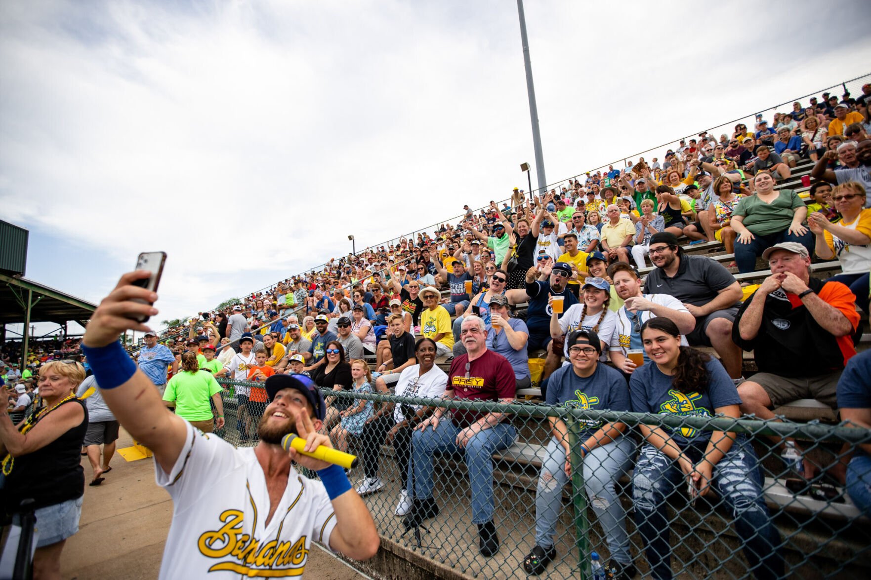 <p>Bill Leroy takes a selfie with some fans.</p>