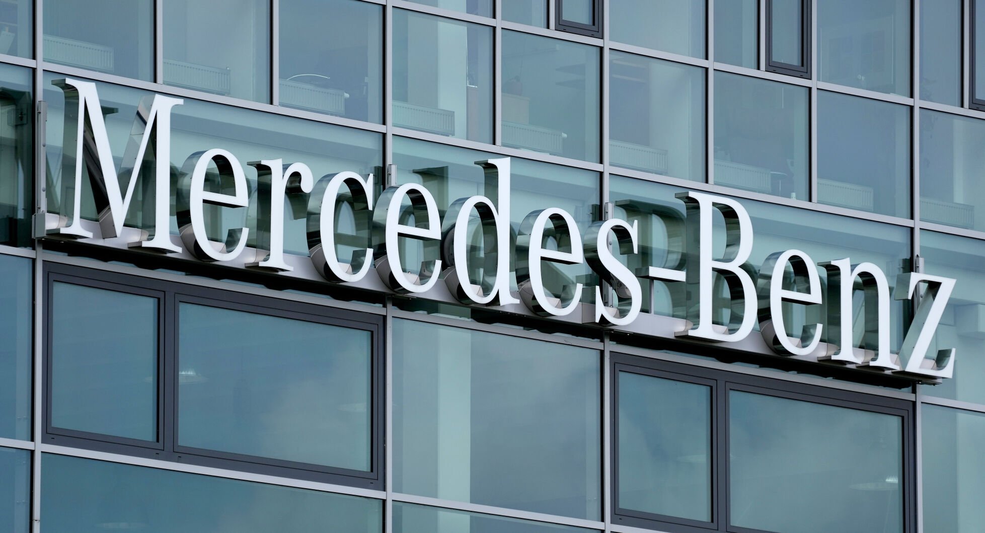 <p>A logo of the German car manufacturer Mercedes-Benz is pictured in Berlin, Germany, in June 2021.</p>
