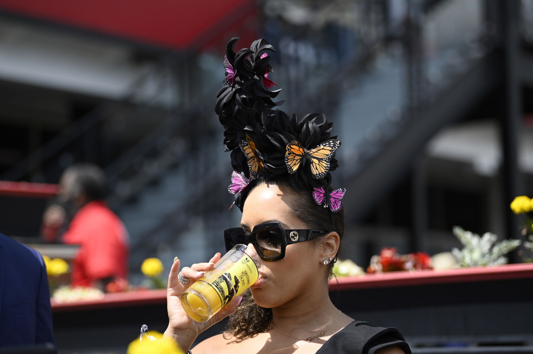 <p>FILE - A woman wears a hat ahead of the Preakness Stakes horse race at Pimlico Race Course, Saturday, May 15, 2021, in Baltimore. Preakness may be a gathering centered around horse racing, but for Baltimore native Lacey Johansson, who has been attending festivities for decades, the hats steal the show. (AP Photo/Nick Wass, File)</p>