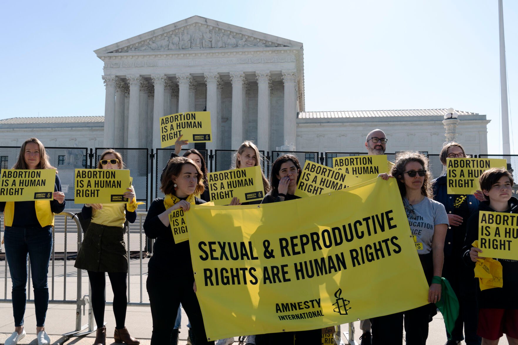 <p>Abortion rights activists protest outside of the U.S. Supreme Court, Wednesday, May 11, 2022 in Washington. A draft opinion suggests the U.S. Supreme Court could be poised to overturn the landmark 1973 Roe v. Wade case that legalized abortion nationwide, according to a Politico report. (AP Photo/Jose Luis Magana)</p>