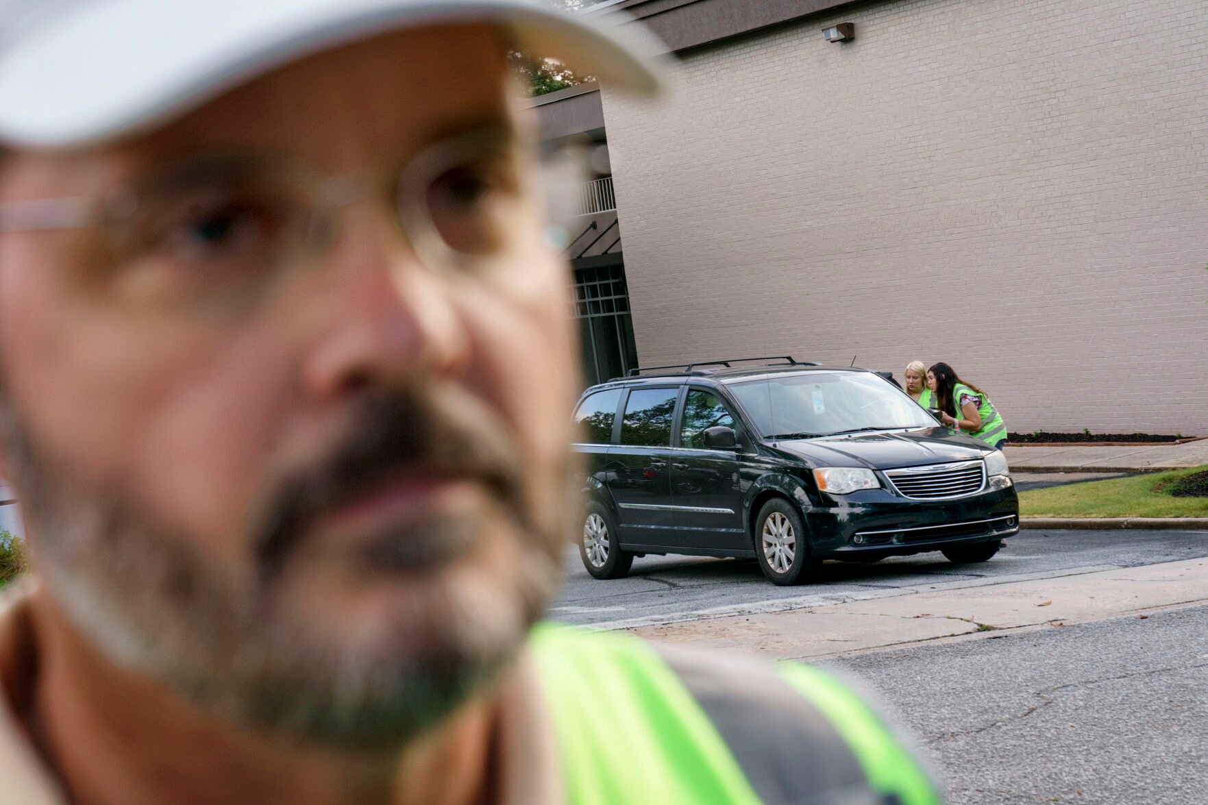 <p>Mark Baumgartner, founder of the anti-abortion group, A Moment of Hope, watches the door of a Planned Parenthood clinic as members of his group are able to talk with a patient arriving for an abortion appointment, Friday, May 27, 2022, in Columbia, S.C. </p>