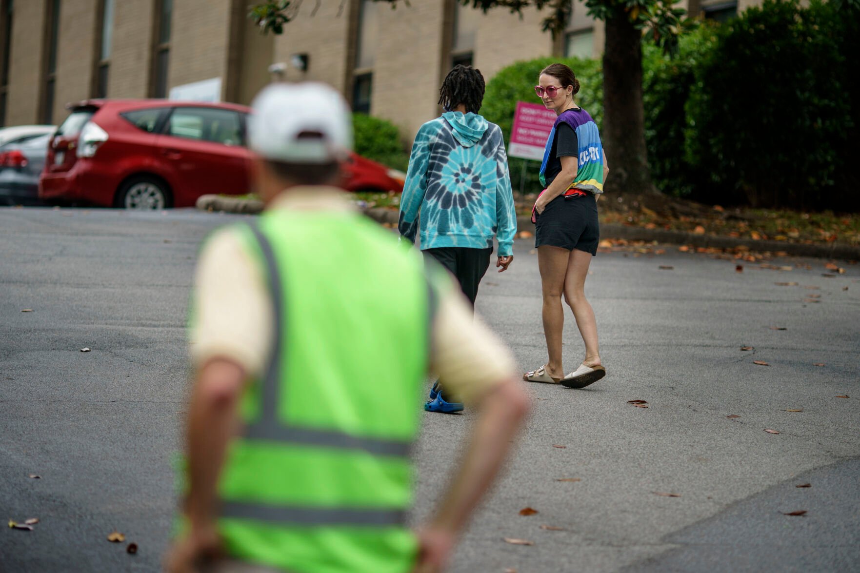 <p>Allison Terracio, right, Planned Parenthood advocacy programs manager, talks with a woman who went over to speak with members of the anti-abortion group, A Moment of Hope, after she arrived for her abortion appointment in Columbia, S.C., Friday, May 27, 2022. </p>