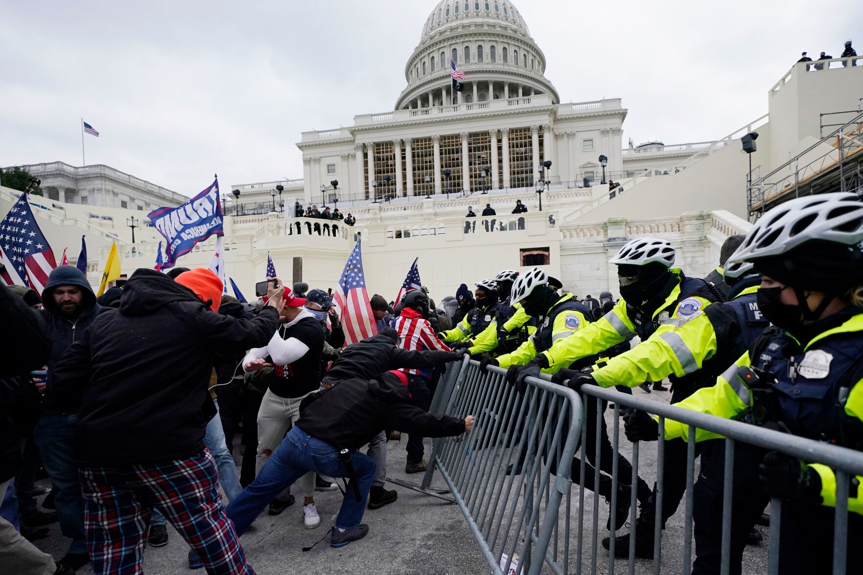<p>FILE - Violent insurrections loyal to President Donald Trump break through a police barrier at the Capitol in Washington. </p>