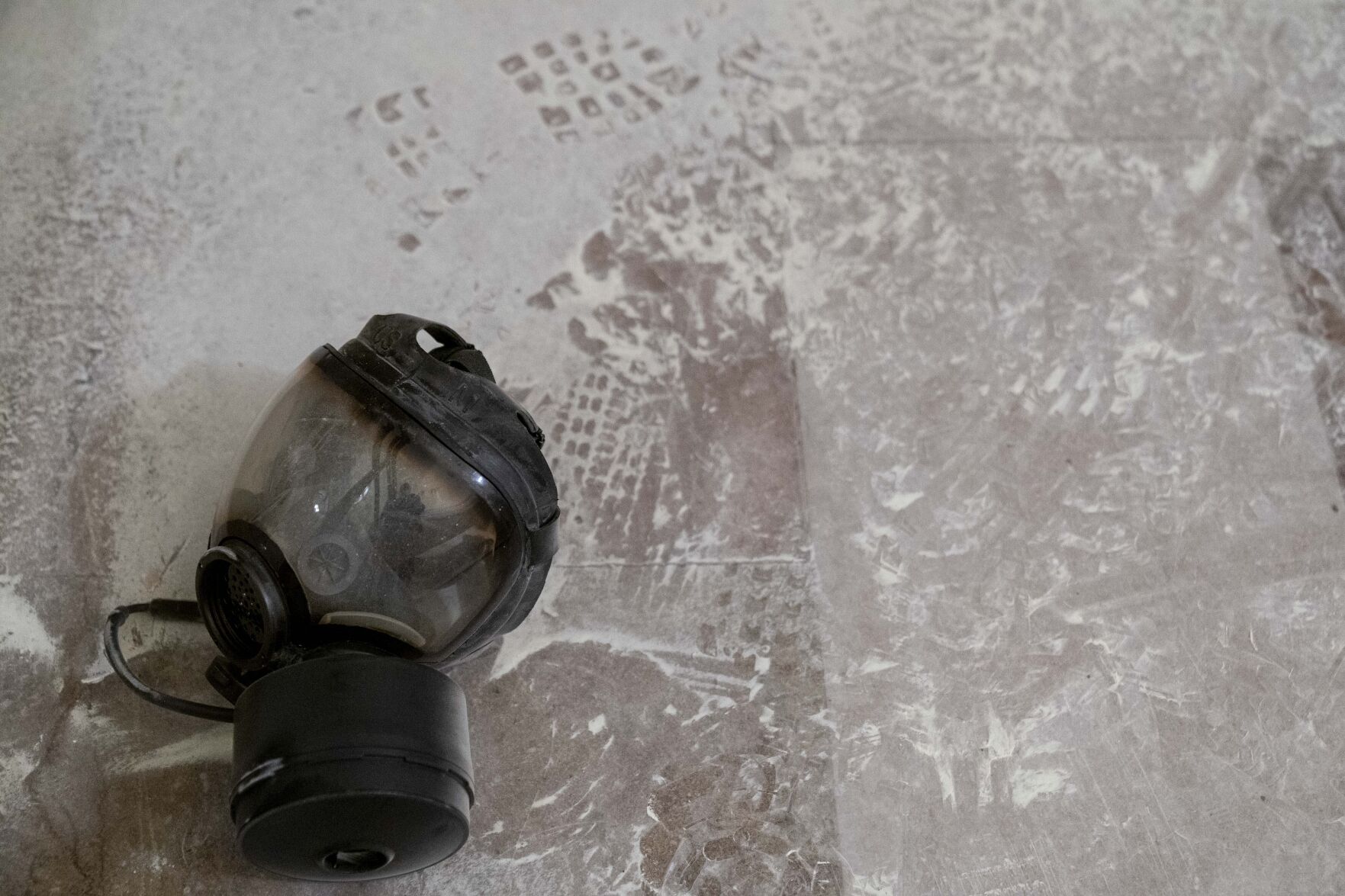 <p>FILE - Dust and a gas mask are visible on the ground in the early morning hours of Jan. 7, 2021, after violent insurrectionists stormed the Capitol in Washington. </p>