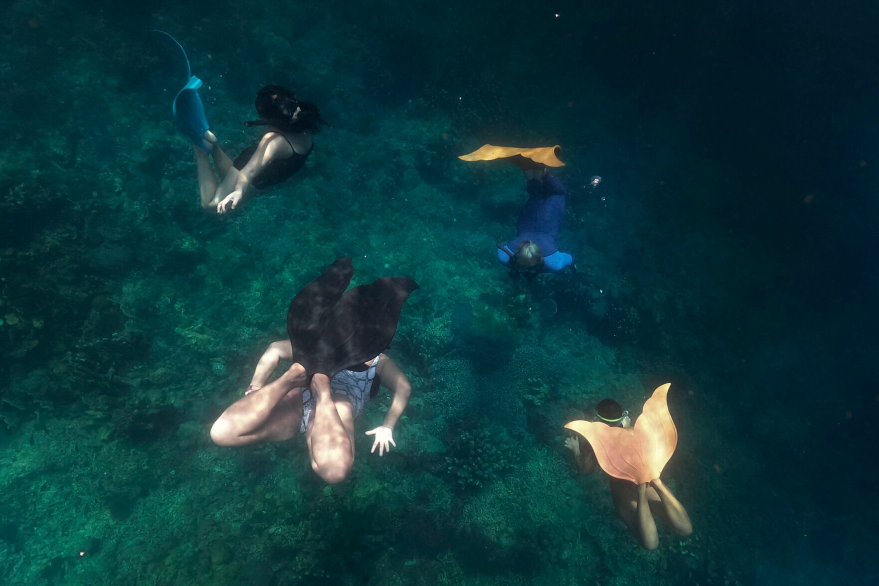 <p>Queen Pangke Tabora, right, conducts a mermaiding class in Mabini, Batangas province, Philippines on Saturday, May 21, 2022. Across the world, people are increasingly embracing the subculture of “mermaiding.” </p>