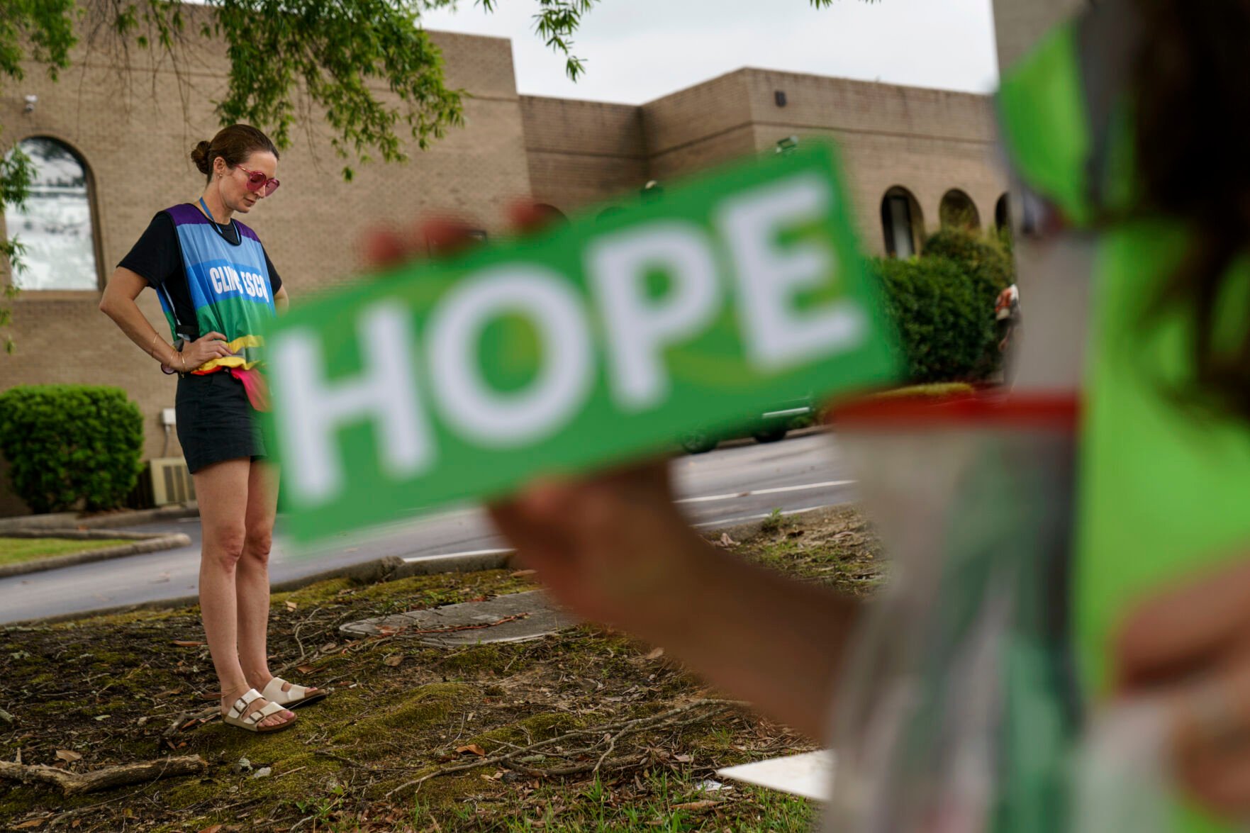 <p>Planned Parenthood advocacy programs manager, Allison Terracio, left, stands outside the clinic to escort patients showing up for abortion appointments as Valerie Berry, program manager for the anti-abortion group, A Moment of Hope, holds up a sign at the entrance in Columbia, S.C., Friday, May 27, 2022.</p>
