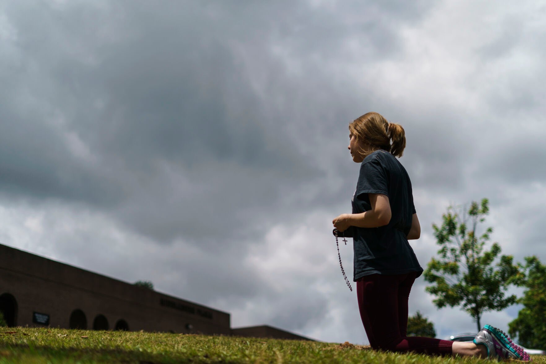 <p>Anna Kelley recites the Rosary while praying outside a Planned Parenthood clinic as patients arrive for abortion appointments, Friday, May 27, 2022, in Columbia, S.C. </p>