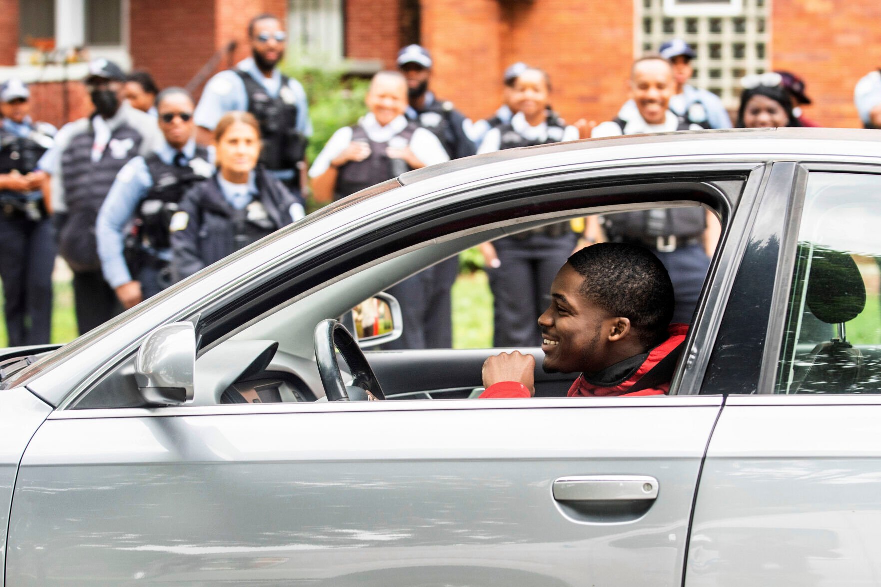 <p>Anthony Perry, 20, sits in a car presented to him by Early Walker, founder of the organization I'm Telling Don't Shoot, Wednesday morning in Chicago. Walker surprised Perry with the car after video of him saving a man from being electrocuted after falling onto the 59th Street red line train tracks went viral earlier in the week.</p>