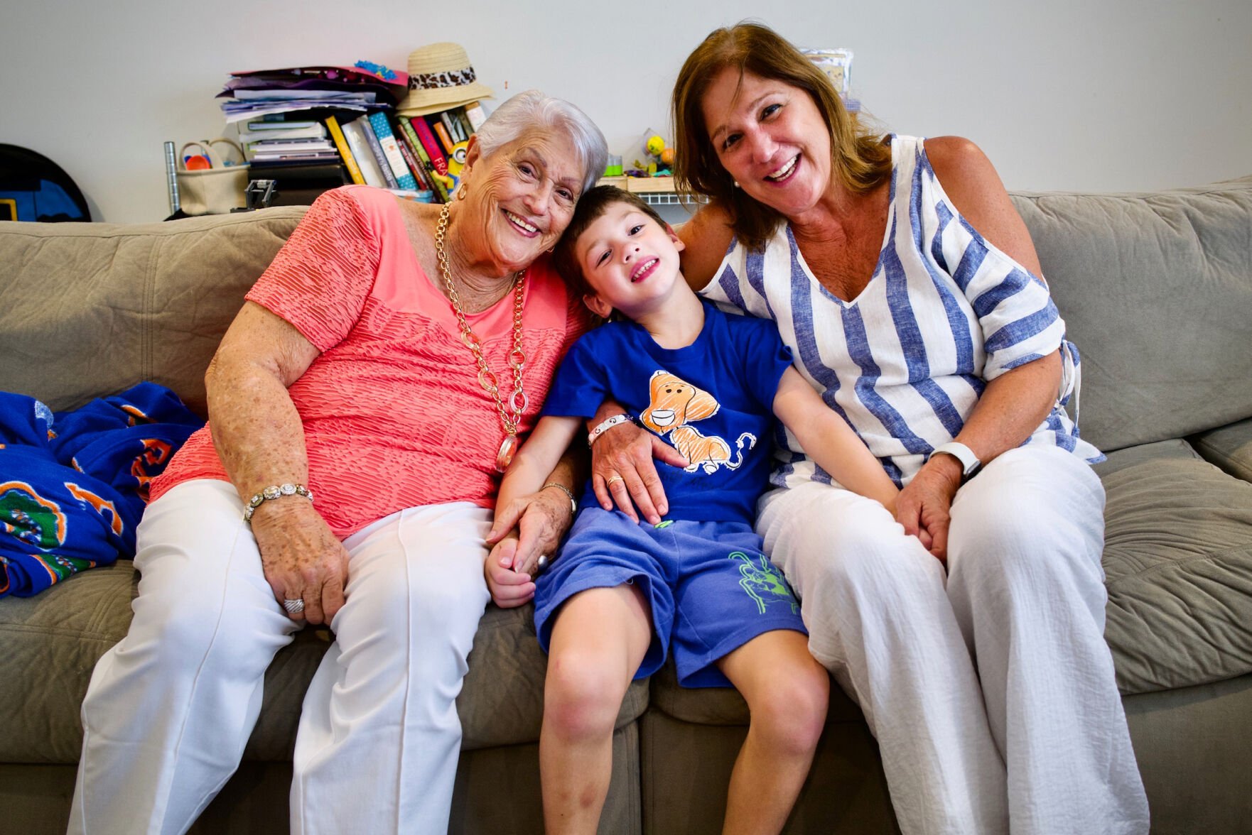 <p>John Rodriguez snuggles with Elena Chavez, left, and Elena Chavez Blasser.</p>