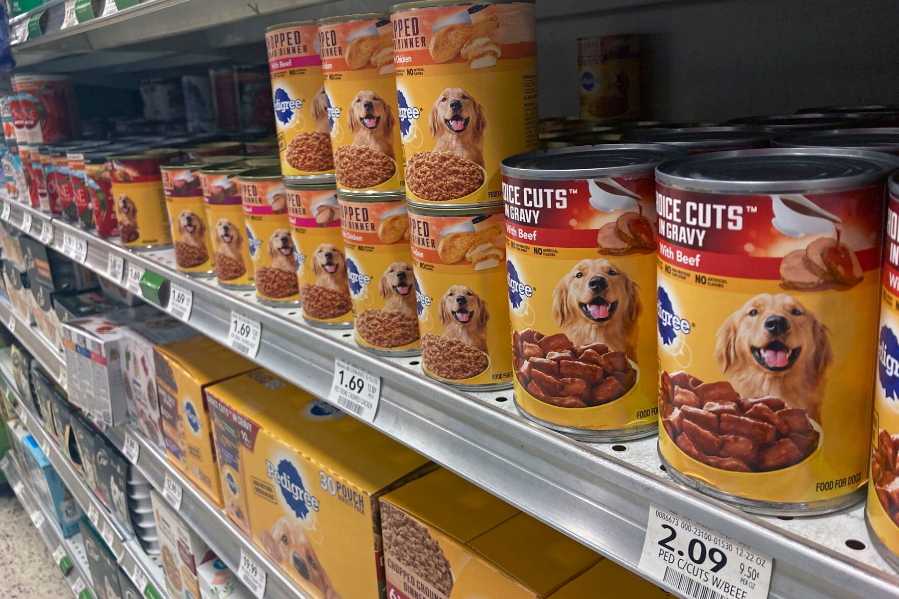 <p>Various types of dog food are seen on display in a supermarket Tuesday, July 19, 2022, in Orlando, Fla. </p>