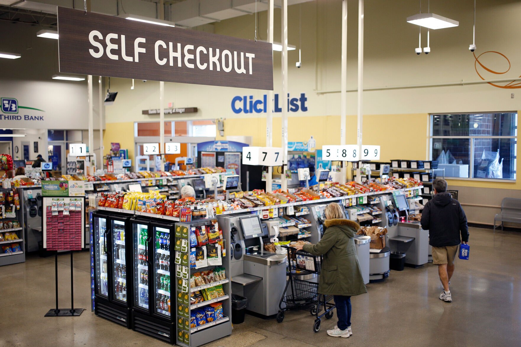 <p>Shoppers use self checkout machines at a Kroger Co. supermarket in Louisville, Kentucky, U.S., on Tuesday, March 5, 2019.</p>
