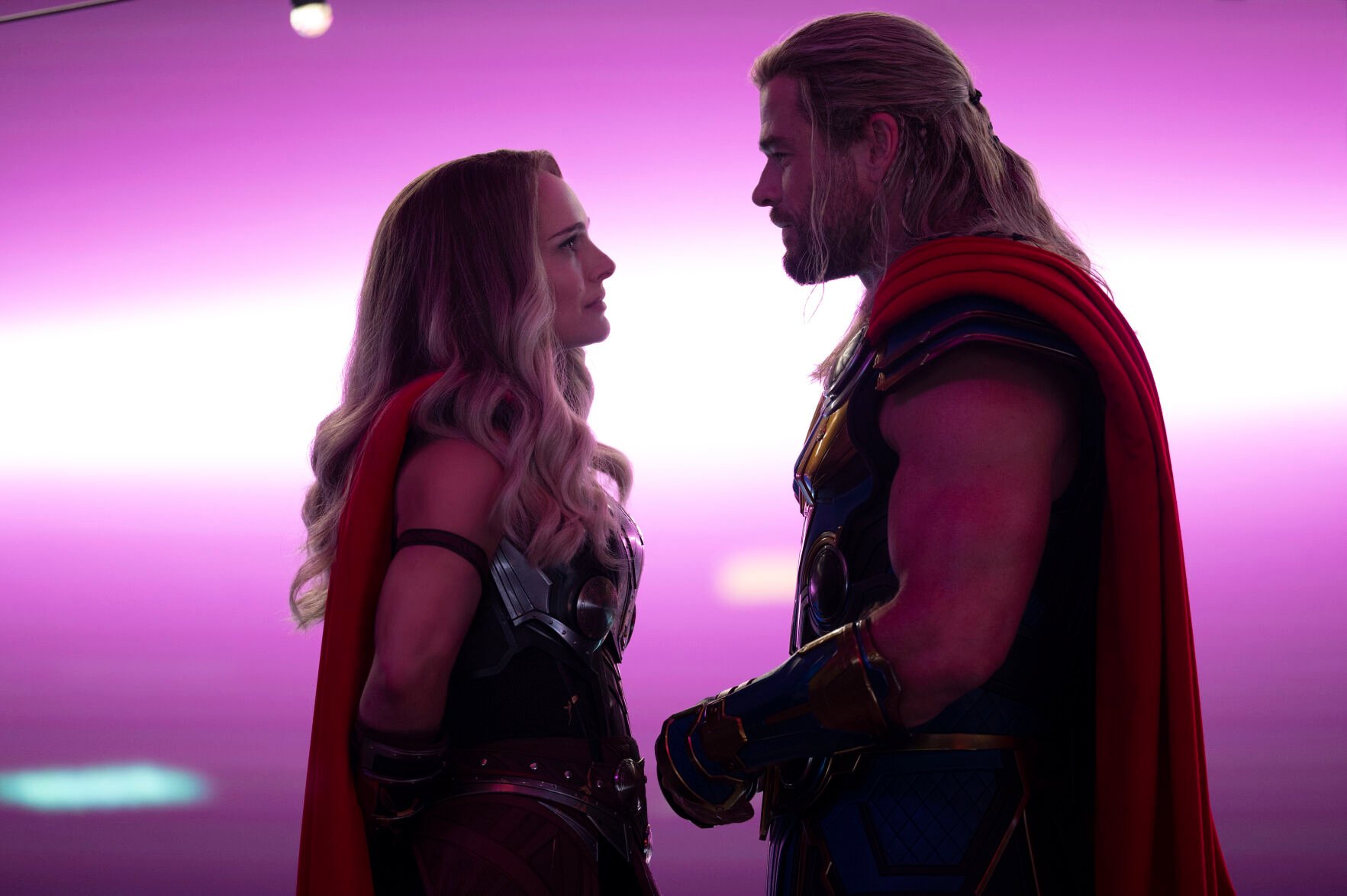 <p>This image released by Marvel Studios shows Natalie Portman, left, and Chris Hemsworth in a scene from "Thor: Love and Thunder." </p>