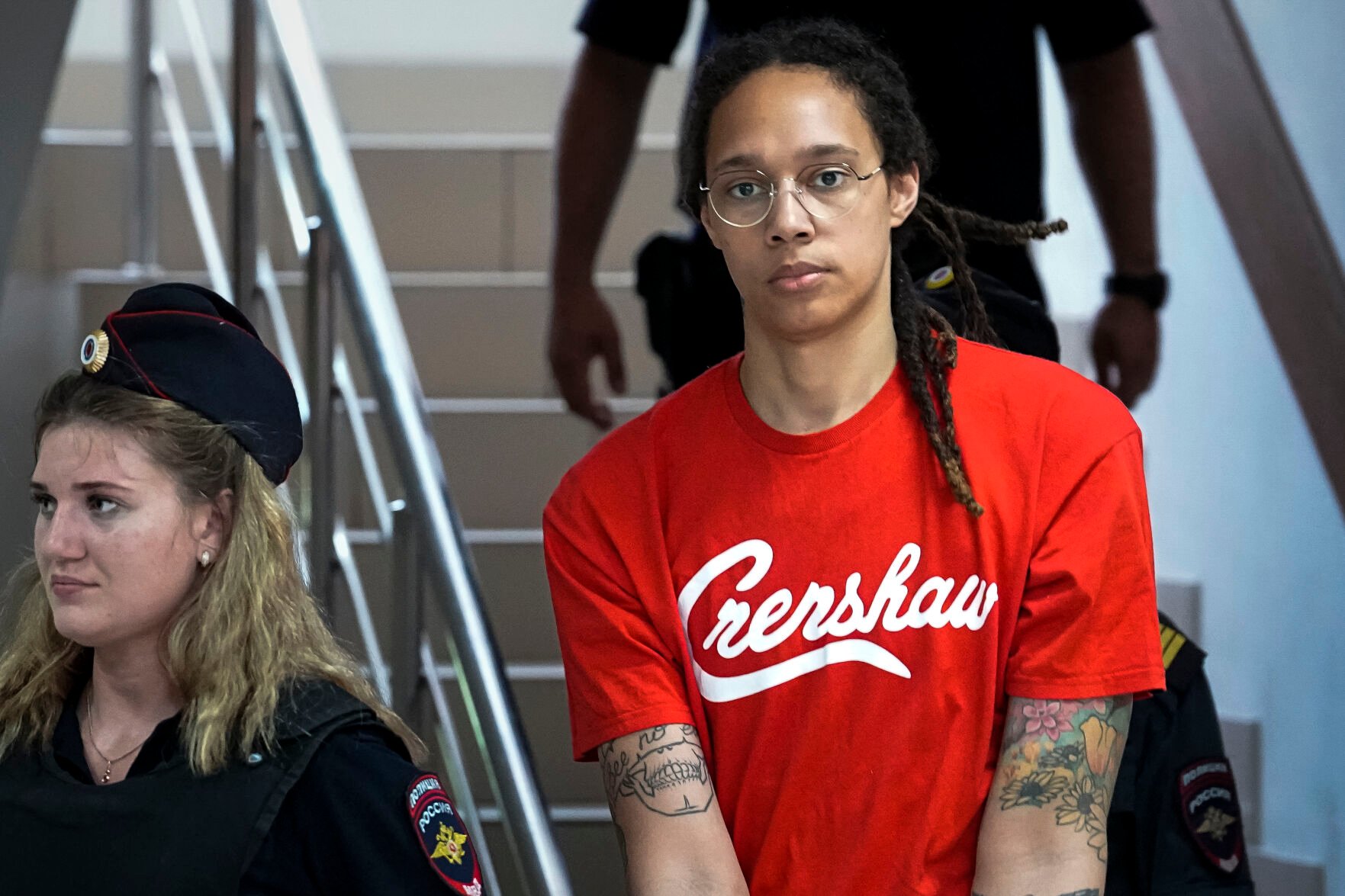 <p>WNBA star and two-time Olympic gold medalist Brittney Griner is escorted to a courtroom for a hearing, in Khimki just outside Moscow, Russia, Thursday, July 7, 2022. Griner pleaded guilty Thursday to drug possession charges on the second day of her trial in a Russian court in a case that could see her sentenced to up to 10 years in prison.</p>
