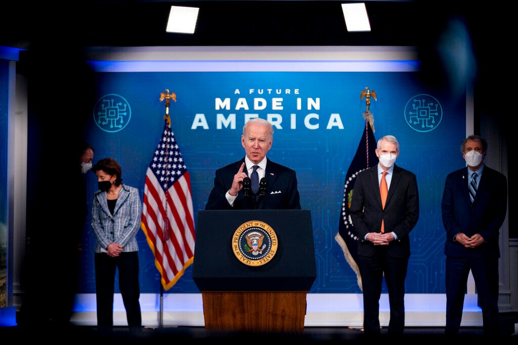 <p>President Joe Biden, accompanied by from left, Intel CEO Patrick Gelsinger, Commerce Secretary Gina Raimondo, Sen. Rob Portman, R-Ohio, and Sen. Sherrod Brown, D-Ohio, as he speaks about Intel's announcement to invest in an Ohio chip making facility, at the South Court Auditorium in the Eisenhower Executive Office Building on the White House Campus in Washington, Friday, Jan. 21, 2022. </p>