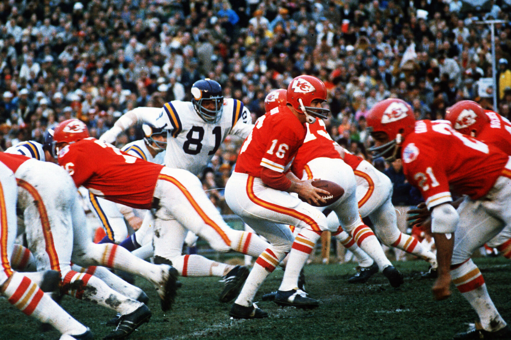 <p>FILE - In this Jan. 11, 1970, file photo, Kansas City Chiefs quarterback Len Dawson (16) turns around to hand the ball off to running back Mike Garrett (21) during the Super Bowl IV football game in New Orleans.</p>