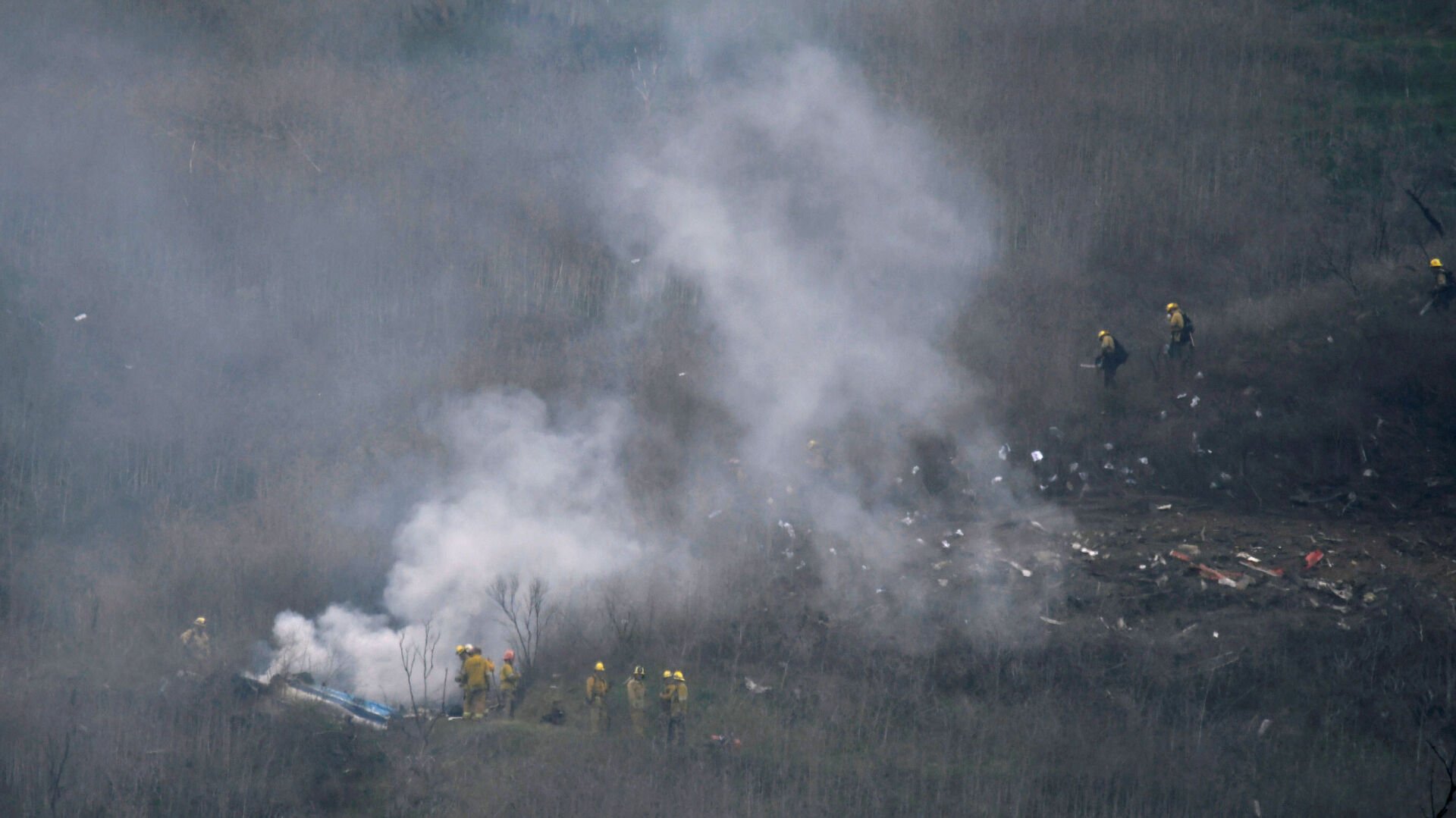 <p>LA county firefighters on the scene of a helicopter crash that reportedly killed Kobe Bryant in Calabasas, California, U.S., January 26, 2020. Photos taken at the scene of the fatal helicopter crash that killed the NBA legend, his daughter and seven others were shared by a Los Angeles County firefighter during the cocktail hour at an awards ceremony a month after the crash, according to witness testimony.</p>