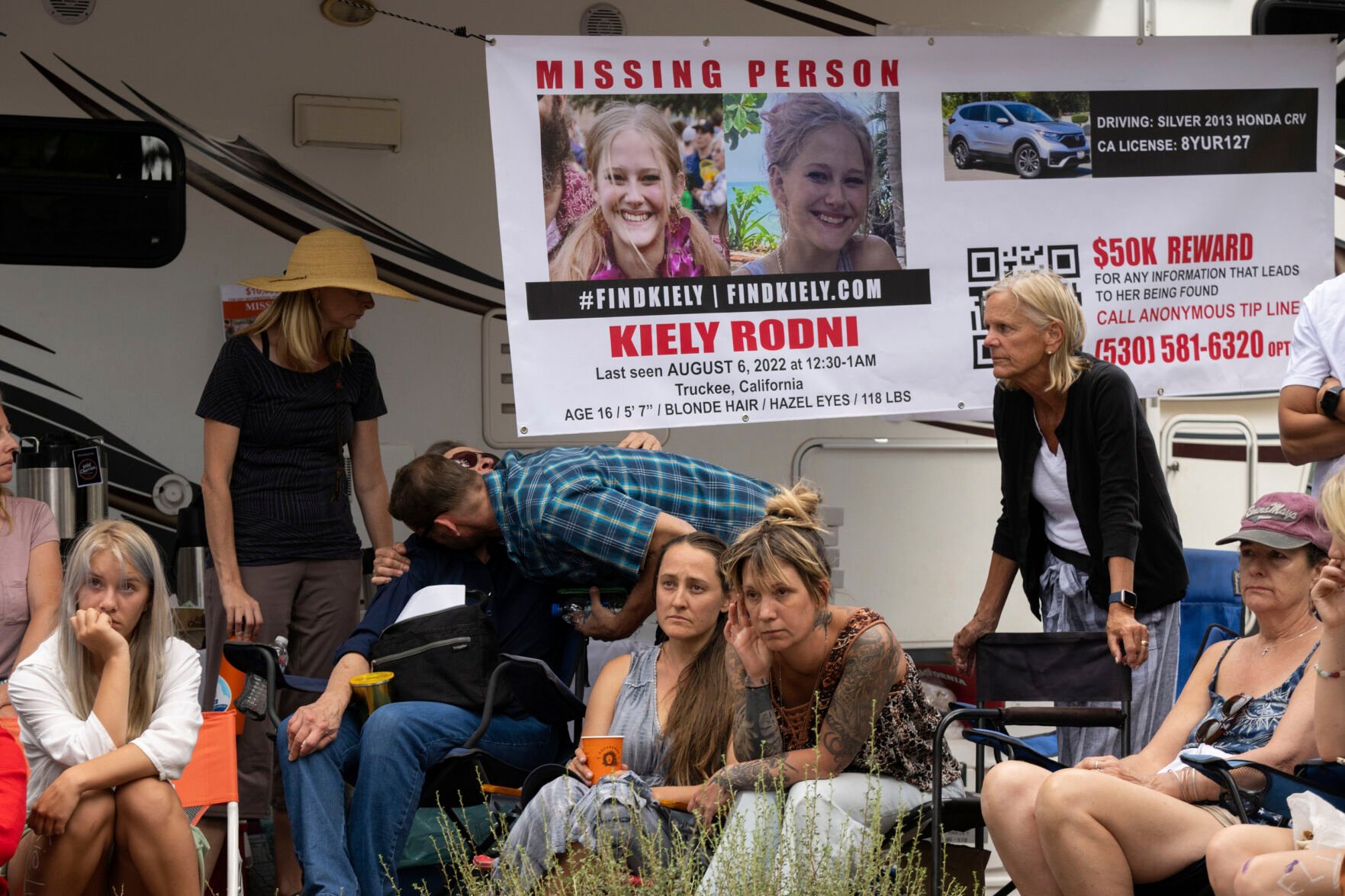 <p>Lindsey Rodni-Nieman, center, mother of missing 16-year-old Kiely Rodni, listens to law enforcement during a news conference, Tuesday, August 9, 2022, in Truckee, Calif. (Paul Kitagaki Jr./The Sacramento Bee via AP)</p>