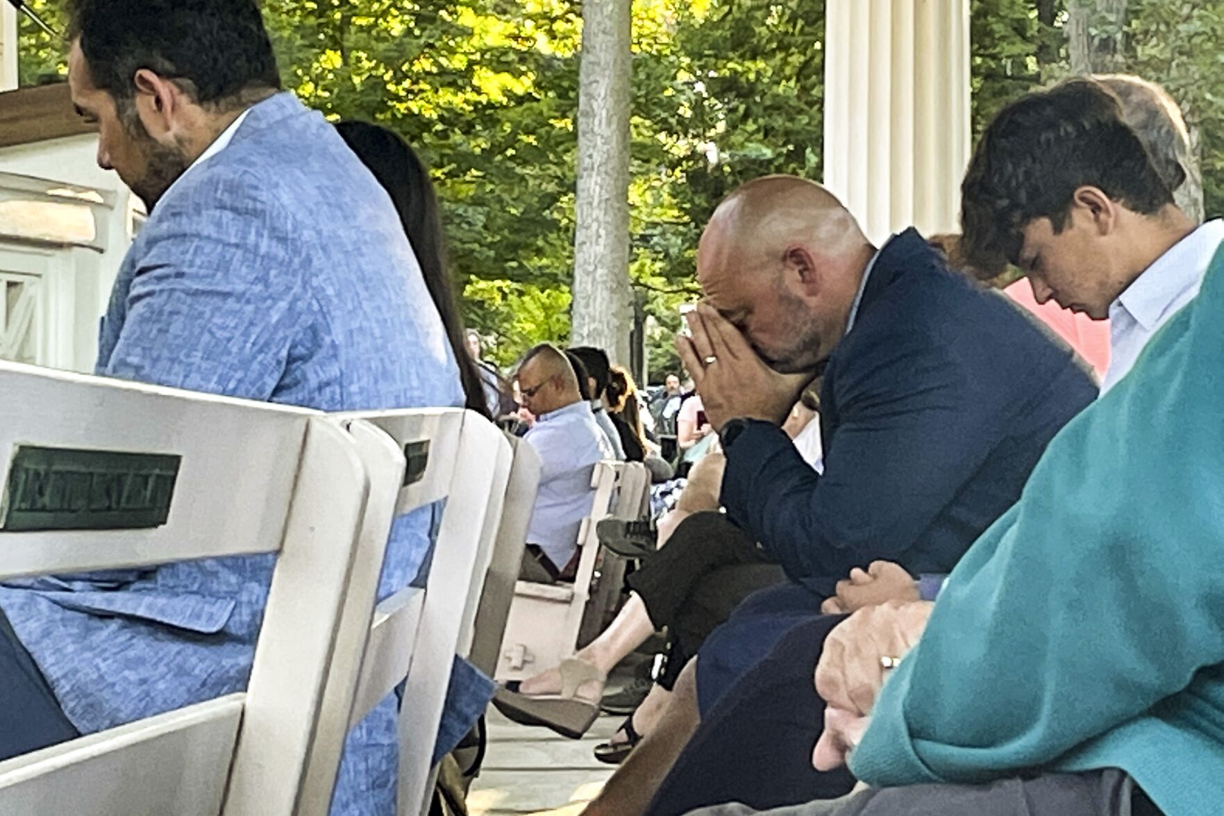 <p>People gather at an evening vigil pray and observe a moment of silence after an attack on author Salman Rushdie, Friday Aug. 12, 2022, in Chautauqua, N.Y. Rushdie, whose novel "The Satanic Verses" drew death threats from Iran in the 1980s, was stabbed as he was about to give a lecture in western New York earlier today. (AP Photo/Joshua Goodman)</p>