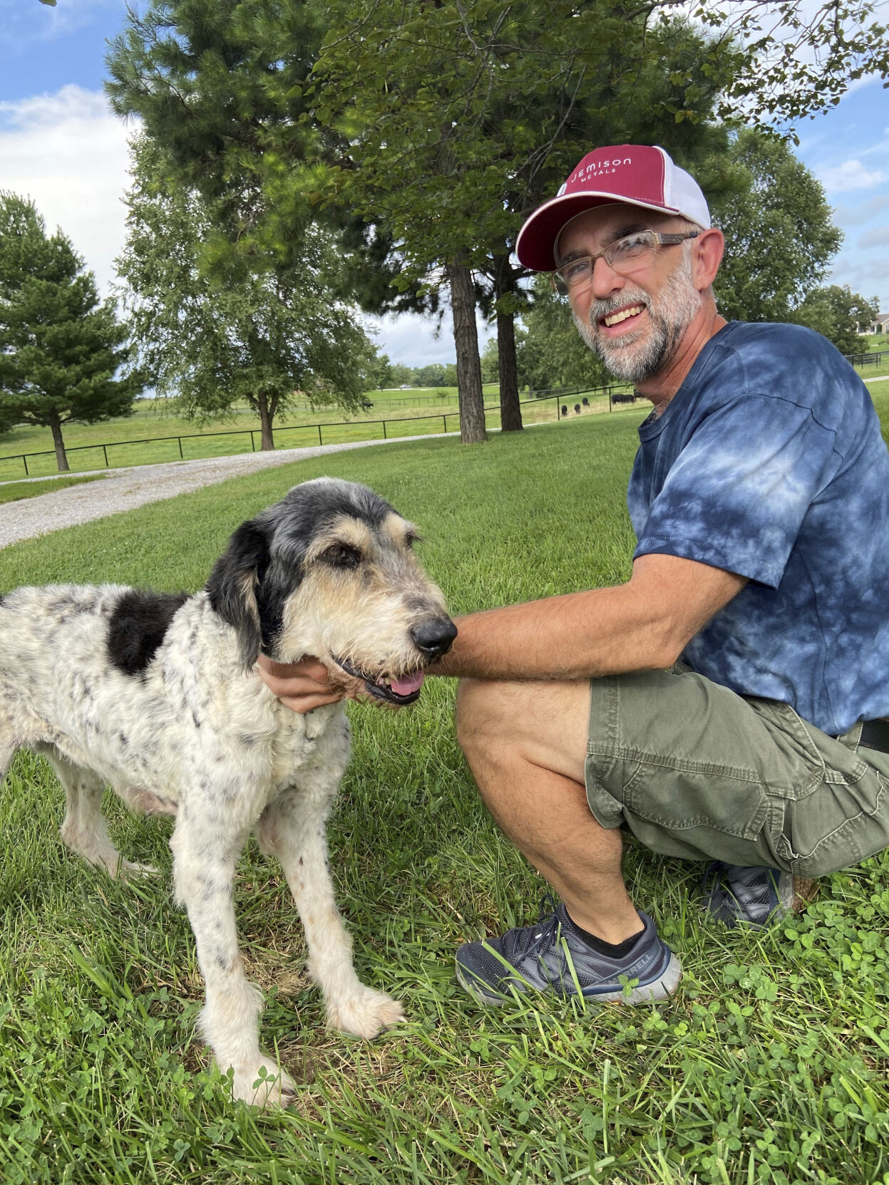 <p>This image provided by Jeff Bohnert and taken by his wife, Kathy Bohnert, shows he and his dog Abby, in August 2022, just days after cavers found Abby inside a cave not far from her home in Perryville, Mo. </p>