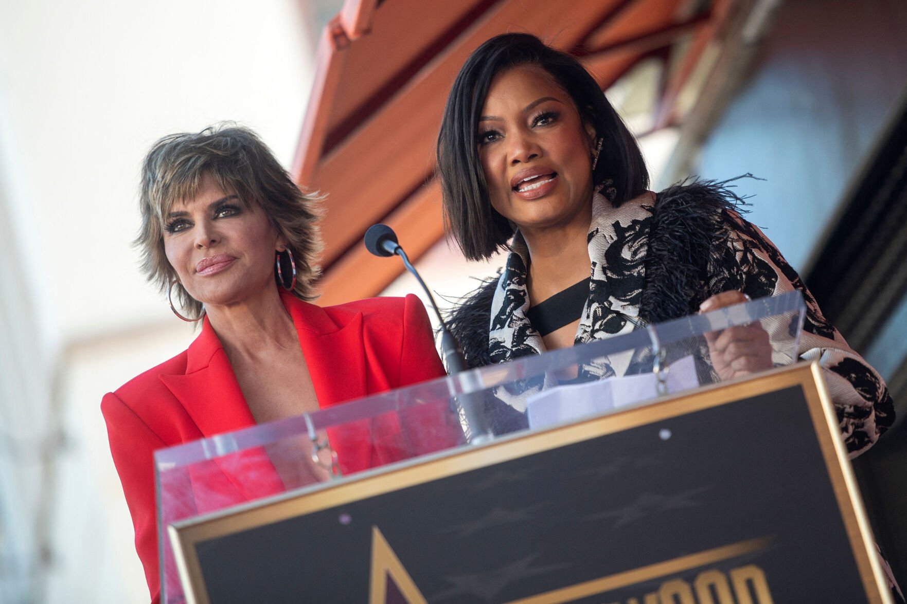 <p>Lisa Rinna, left, and Garcelle Beauvais speak during Andy Cohen's Walk of Fame ceremony in Los Angeles on Feb. 4, 2022. (Valerie Macon/AFP/Getty Images/TNS)</p>
