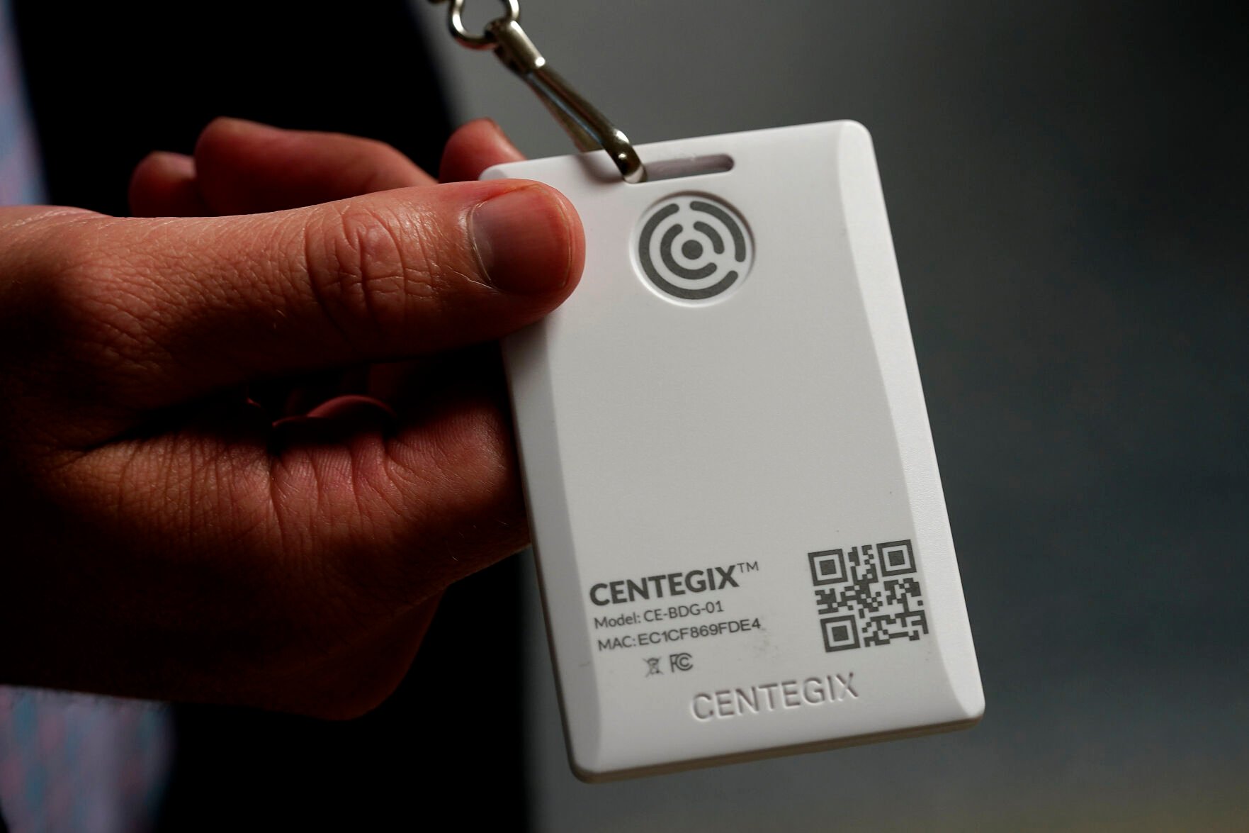 <p>Brent Kiger, Olathe Public Schools' director of safety service, displays a panic-alert button at Olathe South High School Friday, Aug. 19, 2022, in Olathe, Kan. </p>