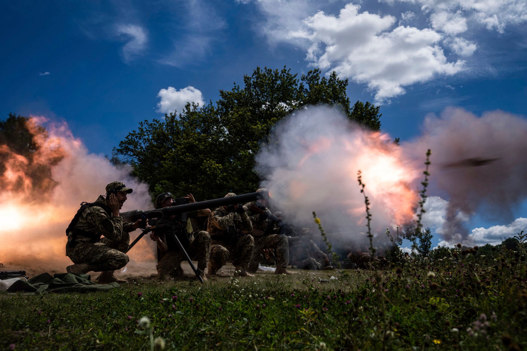 <p>FILE - Ukrainian servicemen shoot with a SPG-9 recoilless gun during training in Kharkiv region, Ukraine, July 19, 2022. </p>