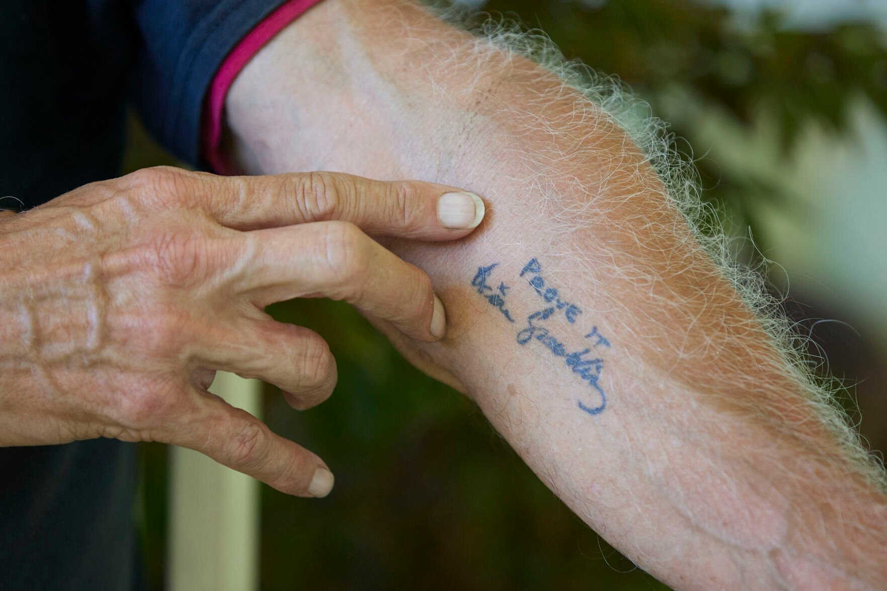 <p>George Spaulding shows his tattoo of one of the favorite phrases of his son, Brian, in Portland, Ore., Wednesday, July 20, 2022. </p>