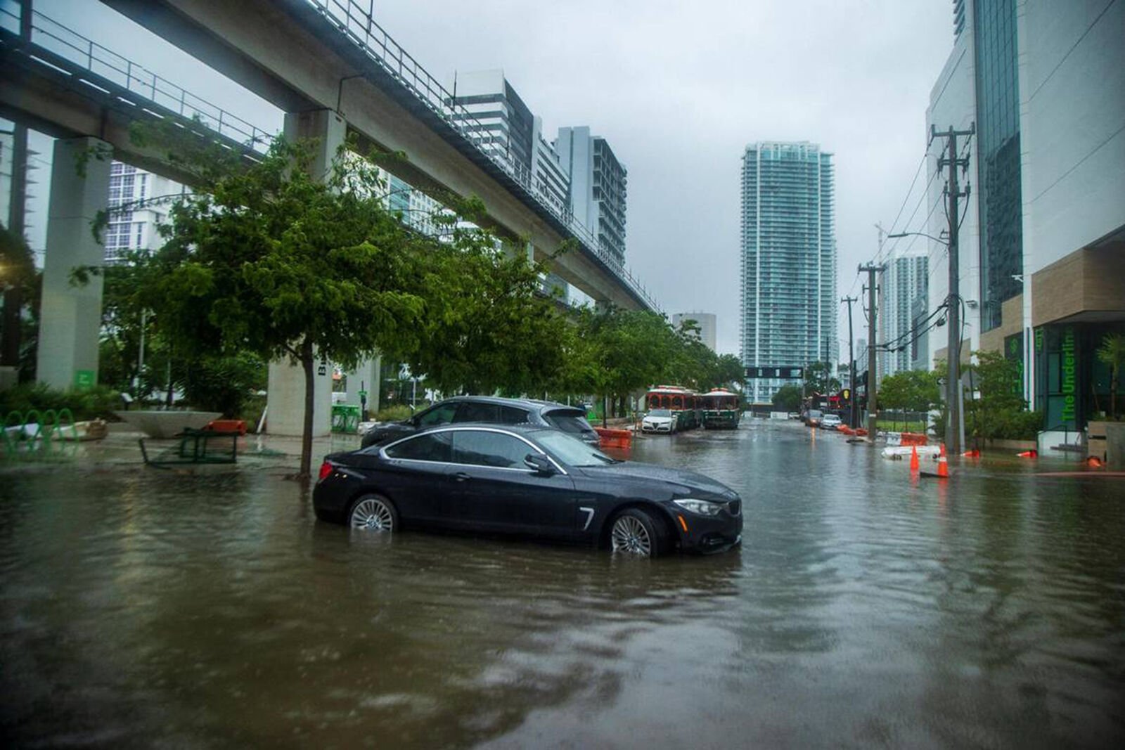 <p>Massive rainfall from the hurricane season's first disturbance caused floods, stranding cars and soaking businesses in an area near downtown Miami on June 4, 2022.</p>