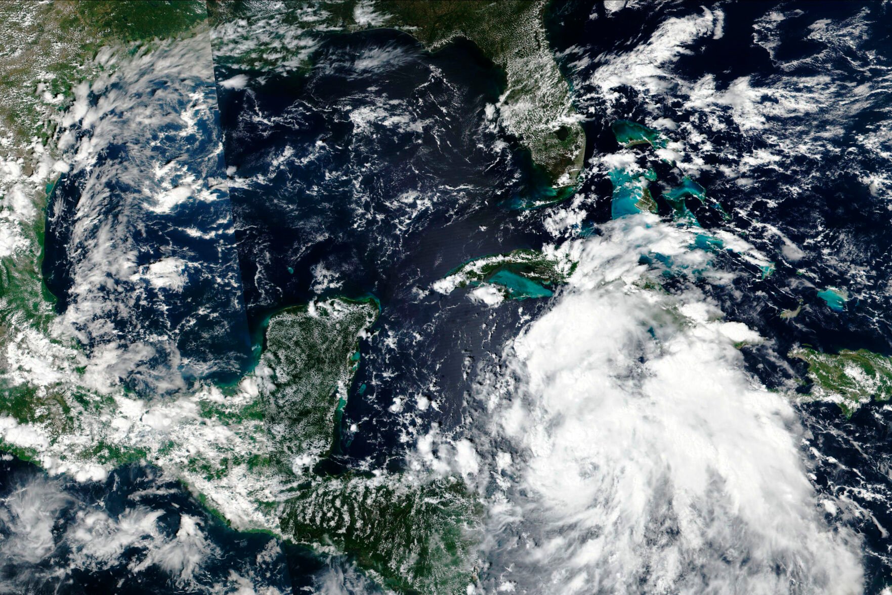 <p>This Sunday satellite image released by NASA shows Hurricane Ian over the Caribbean Sea moving near the Cayman Islands and closer to western Cuba.</p>