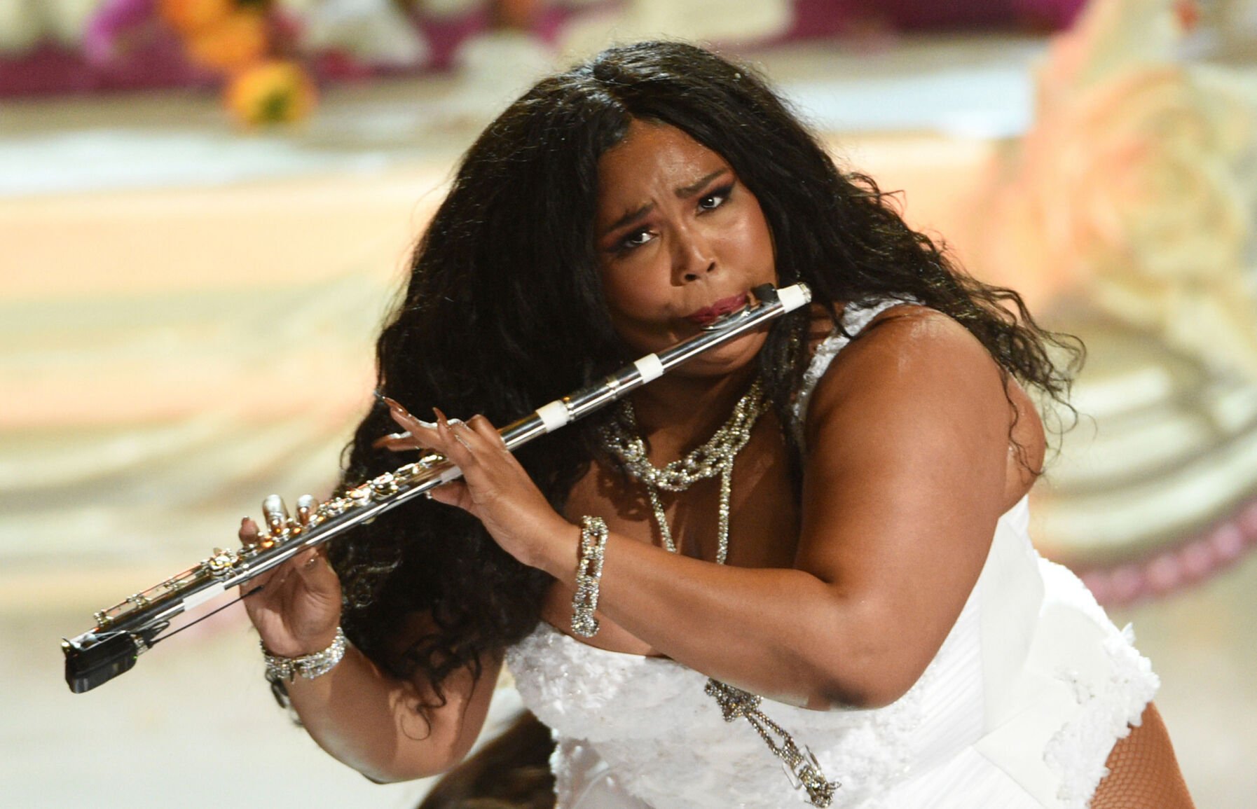 <p>Lizzo plays the flute at the BET Awards in Los Angeles on June 23, 2019.</p>