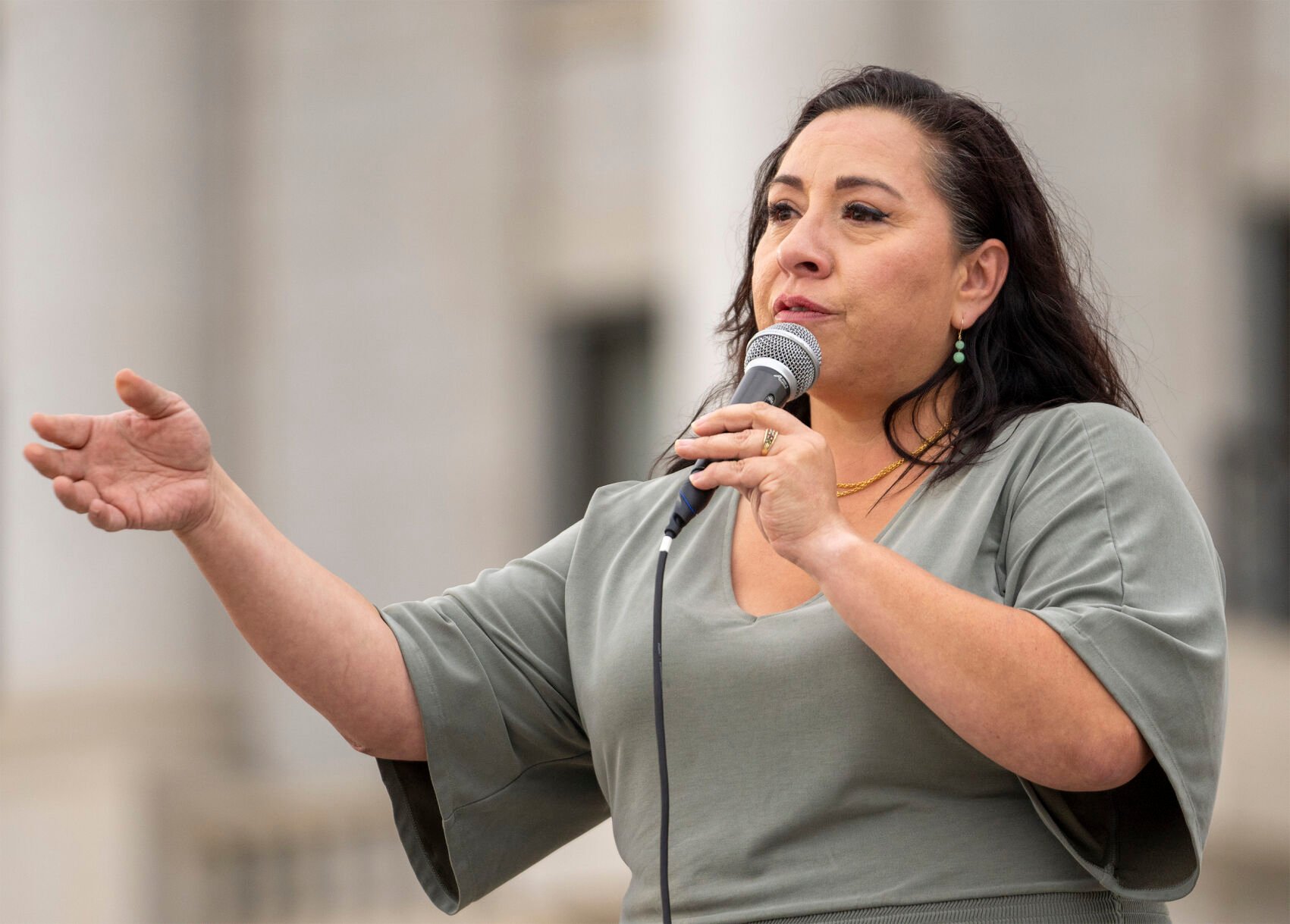 <p>FILE - Rep. Angela Romero speaks on the steps of the state Capitol, during a rally to gain support for removing the clergy exemption from mandatory reporting in cases of abuse and neglect, on Friday, Aug. 19, 2022, in Salt Lake City. (Rick Egan/The Salt Lake Tribune via AP, File)</p>