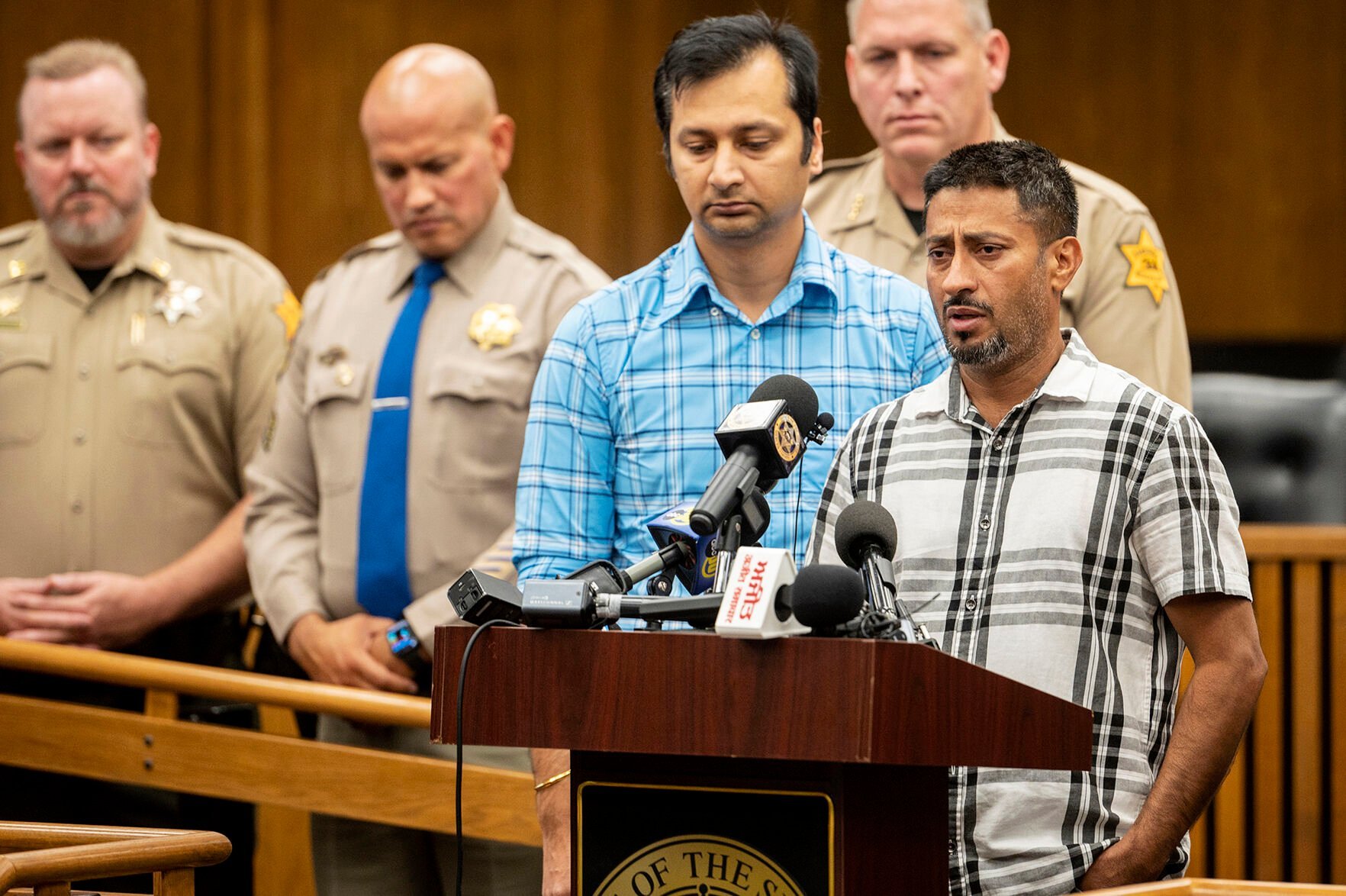 <p>Sukhdeep Singh, right, and Balwinder Saini, middle, speak about the kidnapping of their family members, 8-month-old Aroohi Dheri, her mother Jasleen Kaur, her father Jasdeep Singh, and her uncle Amandeep Singh at a news conference in Merced, Calif., on Wednesday, Oct. 5, 2022. </p>