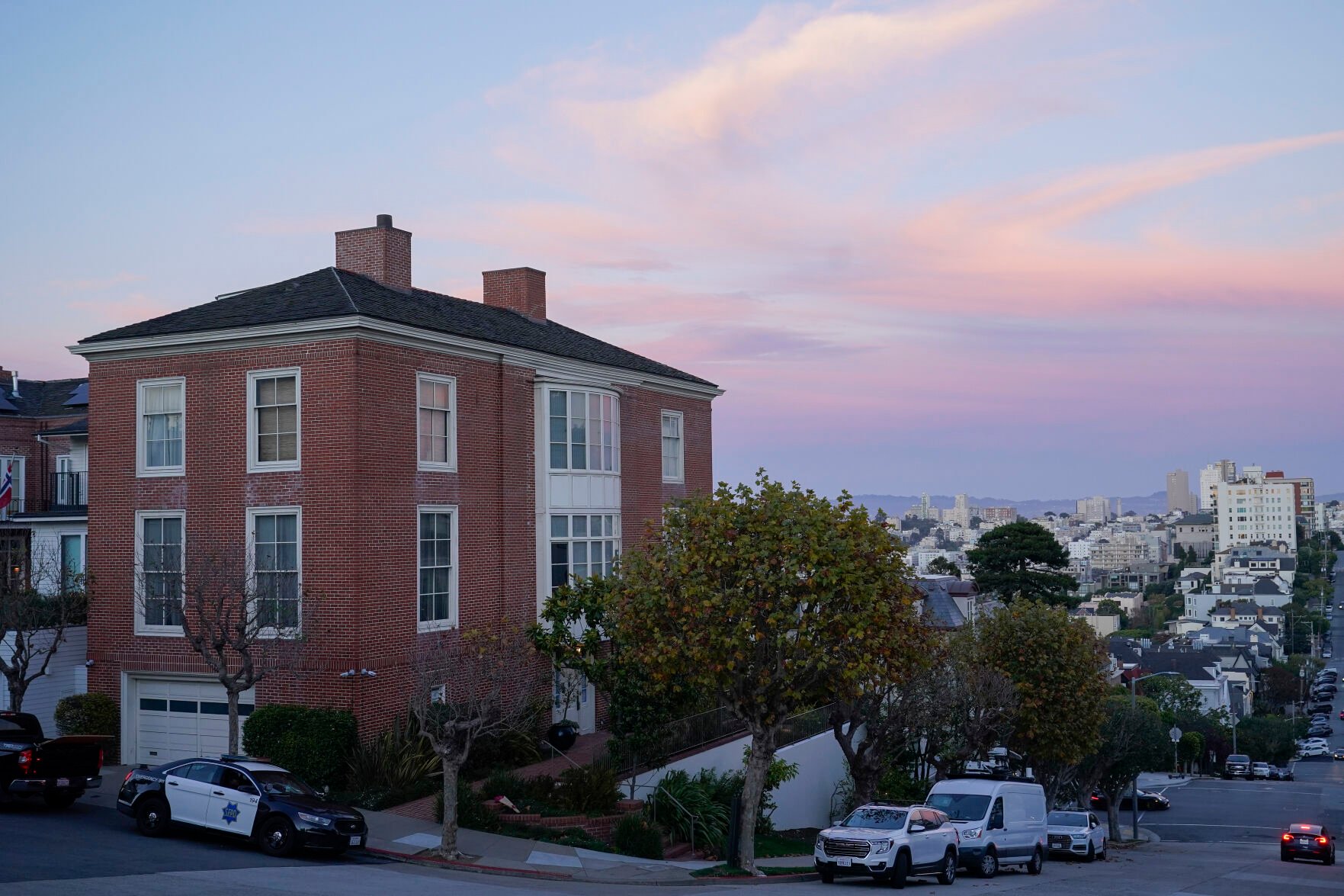<p>A police car can be seen parked outside the home of Paul Pelosi, the husband of House Speaker Nancy Pelosi, in San Francisco, Friday, Oct. 28, 2022. Paul Pelosi, was attacked and severely beaten by an assailant with a hammer who broke into their San Francisco home early Friday, according to people familiar with the investigation.</p>