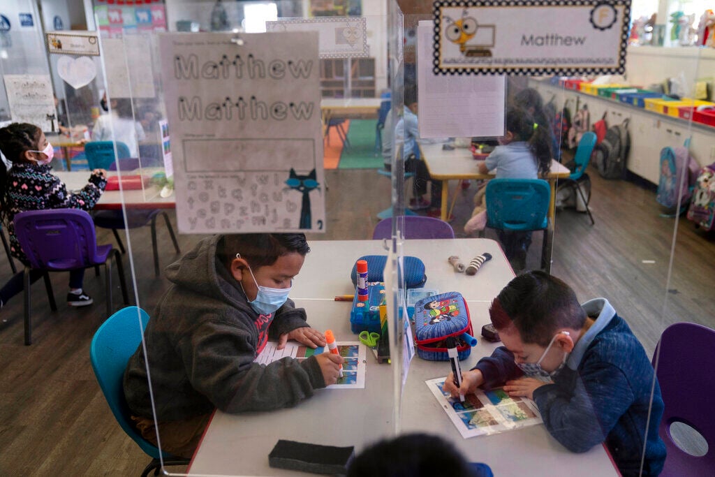 <p>FILE - Pre-kindergarten students work on their school work at West Orange Elementary School in Orange, Calif., March 18, 2021. </p>