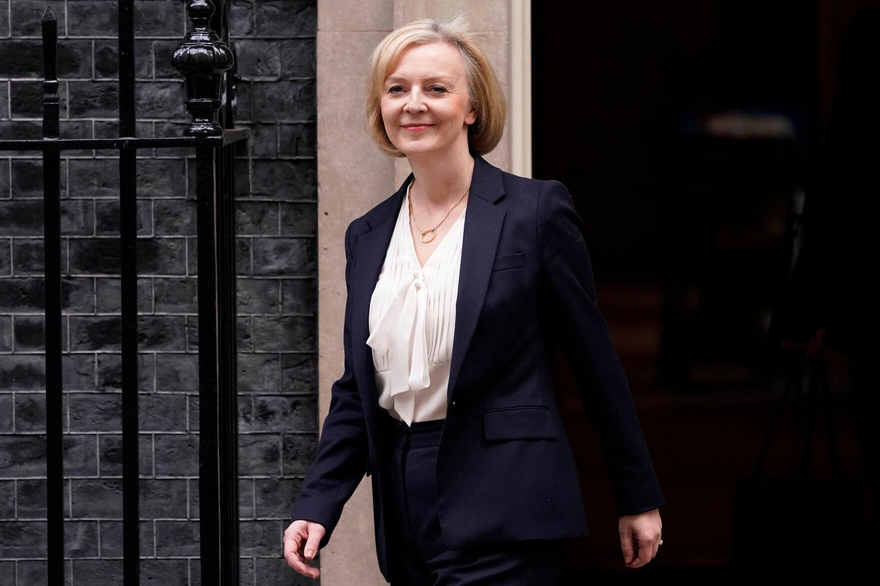 <p>Britain's Prime Minister Liz Truss leaves 10 Downing Street to attend the weekly Prime Ministers' Questions session in parliament in London, Wednesday, Oct. 19, 2022. </p>