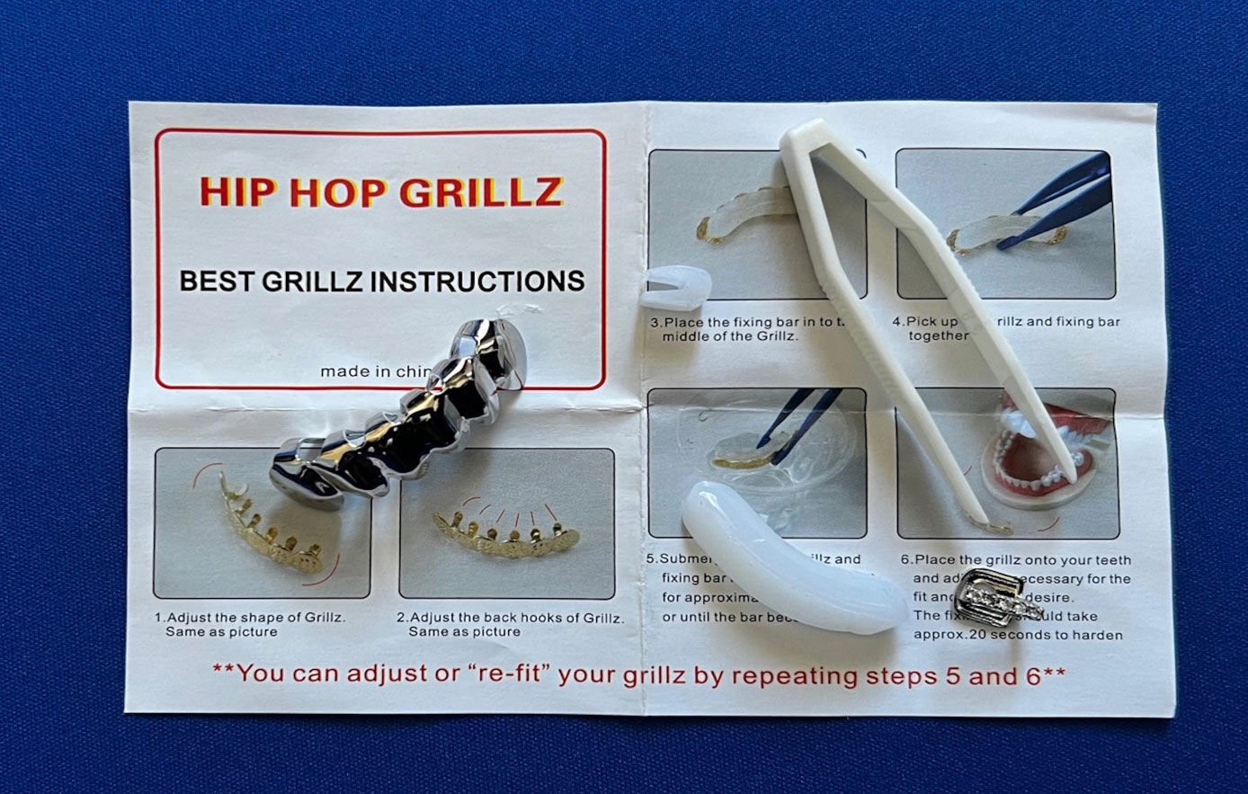 <p>A silver-plated brass set of grills comes with a bottom front, single top and plastic tweezers for .99, sold through Amazon.</p>