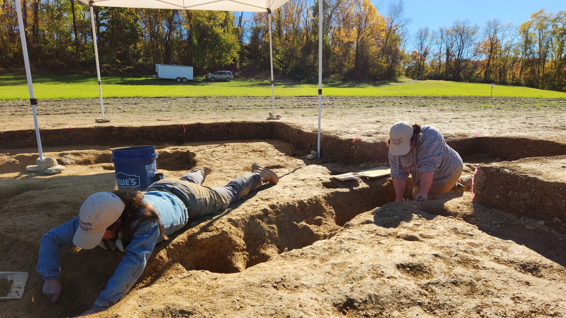 <p>Jane C. Skinner and Samantha Muscella excavate post holes at the bottom of a stockade trench Thursday in York, Pa.</p>