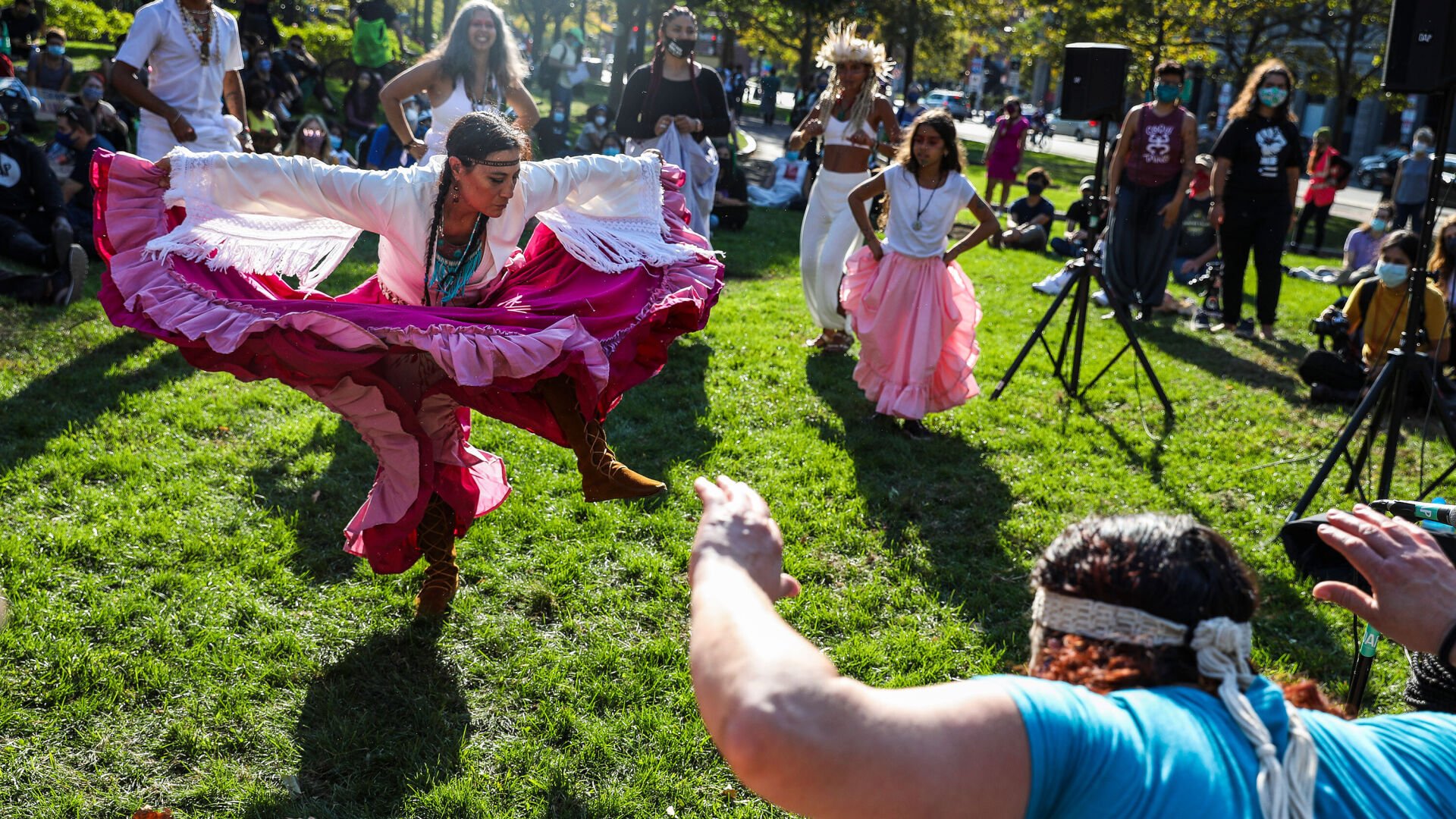 <p>Chali'Naru Dones, with the United Confederation of Taino People, dances in the Christopher Columbus Waterfront Park during an Indigenous Peoples' Day rally and march in Boston on October 10, 2020.</p>