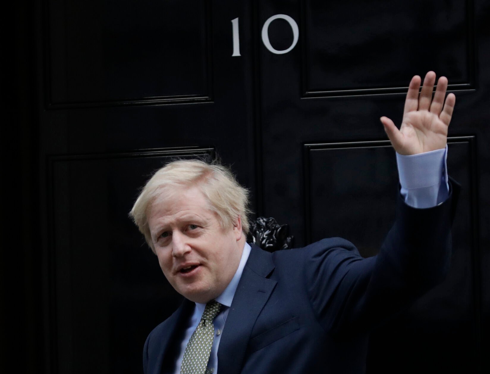 <p>FILE - Britain's Prime Minister Boris Johnson returns to 10 Downing Street after meeting with Queen Elizabeth II at Buckingham Palace, London, on Friday, Dec. 13, 2019. Under Britain's parliamentary system, the public never actually votes for its prime minister. Instead, voters tick the box for a representative from their local area, who then becomes one of Britain’s 650 Members of Parliament. The party that wins a majority forms a government and puts their leader into the prime minister's seat. (AP Photo/Matt Dunham, File)</p>