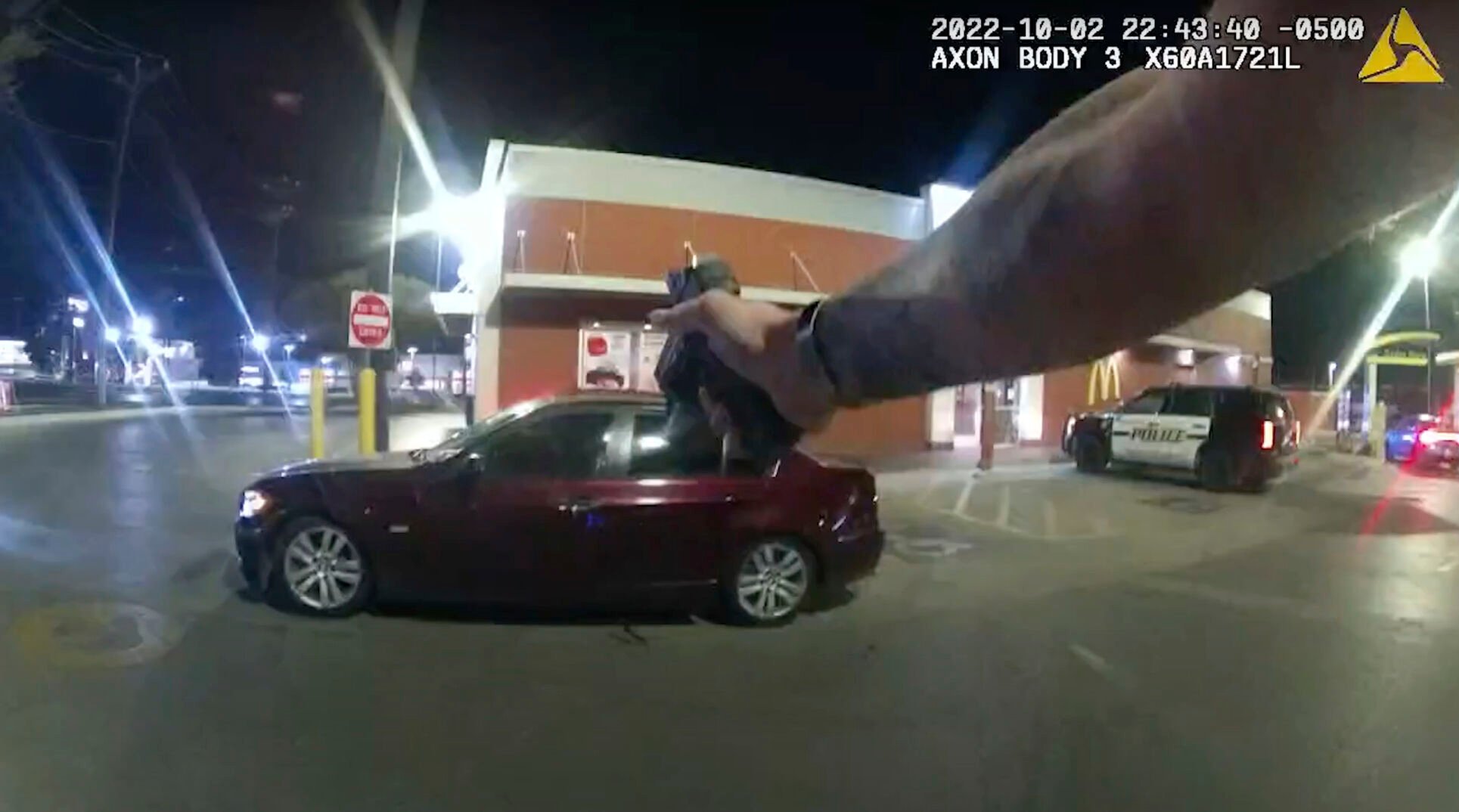 <p>In this image taken from Oct. 2, 2022 police body camera video and released by San Antonio Police Department, Erik Cantu drives away as San Antonio Police officer James Brennand shoots his pistol at the car in a fast food restaurant parking lot in San Antonio, Texas. Brennand opened fire several times wounding the unarmed teenager as he drove away. Brennand was fired after the shooting, police training commander Alyssa Campos said in a video statement released Wednesday, Oct. 5, 2022. (San Antonio Police Department via AP)</p>