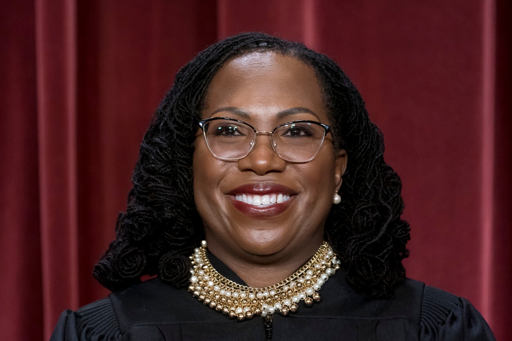 <p>Associate Justice Ketanji Brown Jackson stands as she and members of the Supreme Court pose for a new group portrait following her addition, at the Supreme Court building in Washington, Friday, Oct. 7, 2022. </p>