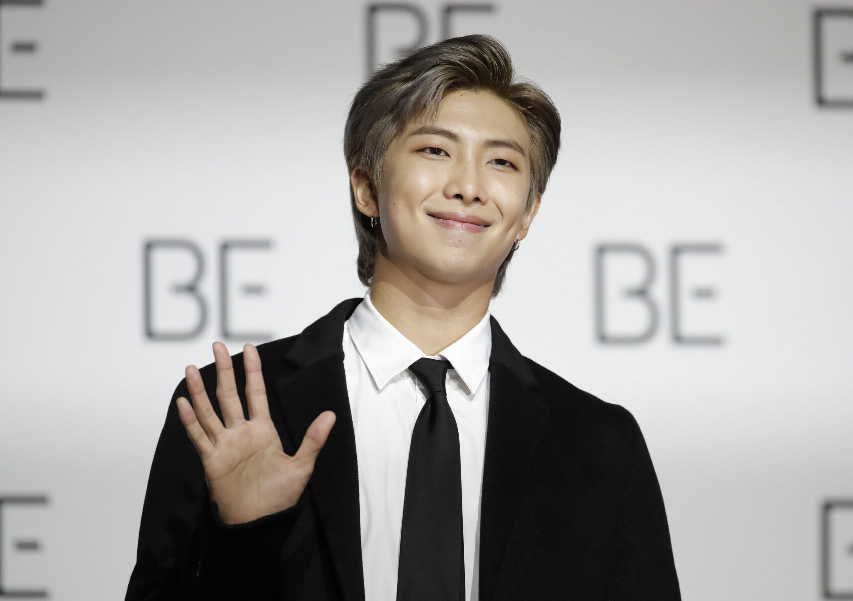 <p>FILE - RM, a member of South Korean K-pop band BTS, poses for photographers during a press conference in Seoul, South Korea on Nov. 20, 2020. RM will release his debut solo album, “Indigo,” on Friday, Dec. 2. (AP Photo/Lee Jin-man, File)</p>