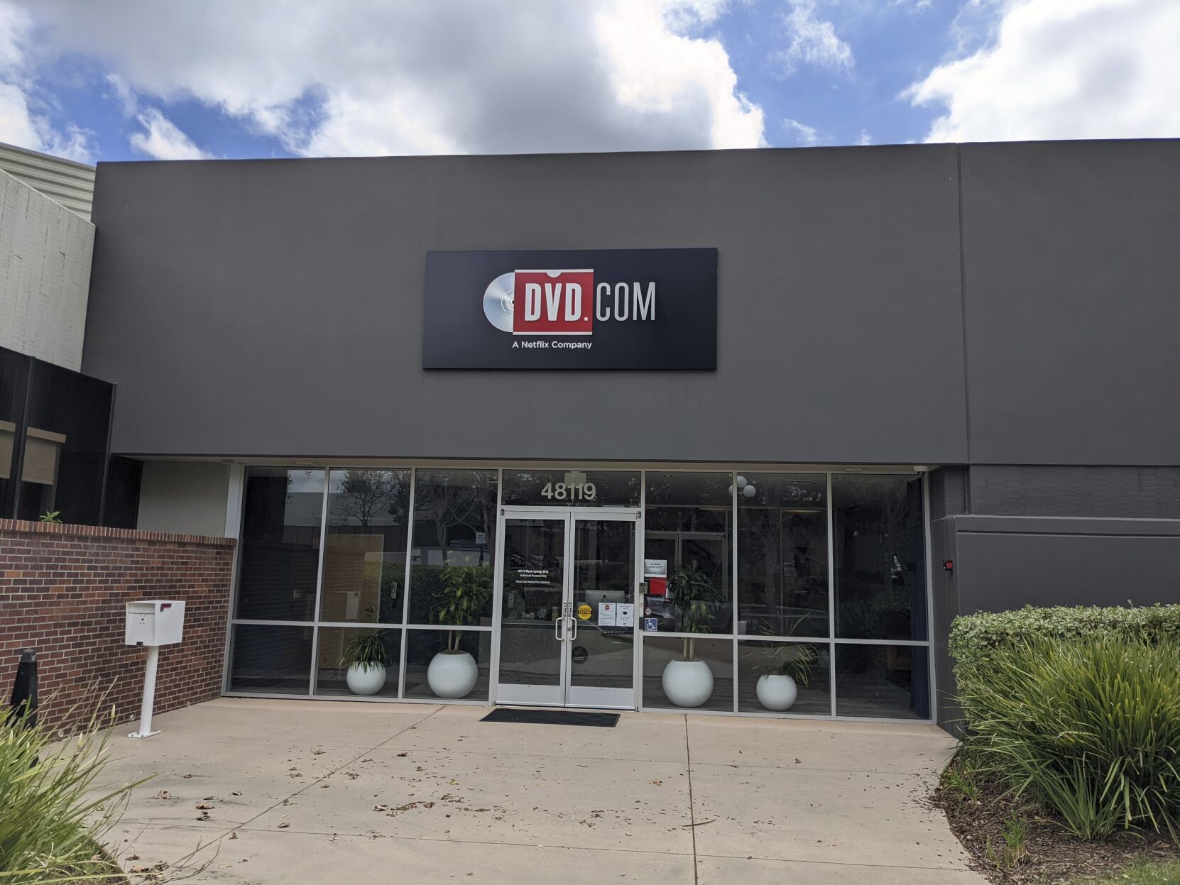 <p>Netflix’s DVD-by-mail rental service, now called DVD.com, is seen in a non-descript office in Fremont, Calif. March 29, 2022, It is located about 20 miles from Netflix’s main campus in Los Gatos, Calif. Netflix’s trailblazing DVD-by-mail rental service has been relegated as a relic in the age of video streaming, but there is still a steady — albeit shrinking — audience of diehards who are happily paying to receive those discs in the iconic red-and-white envelopes. (AP Photo/Michael Liedtke)</p>