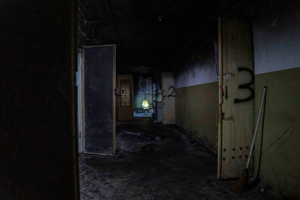 <p>FILE - An office chair stands in the corridor of a basement in a building used, according to a war crimes prosecutor, by Russian forces as a place of torture in Kherson, Ukraine, Dec. 8, 2022. </p>
