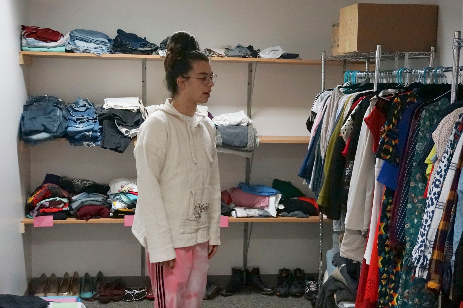 <p>Sean Fisher, one of the student coordinators for QPLUS, the LGBTQ student organization for the College of Saint Benedict and Saint John's University, stands in the organization's dedicated lounge on the college's campus in St. Joseph, Minn., on Tuesday, Nov. 8, 2022. </p>