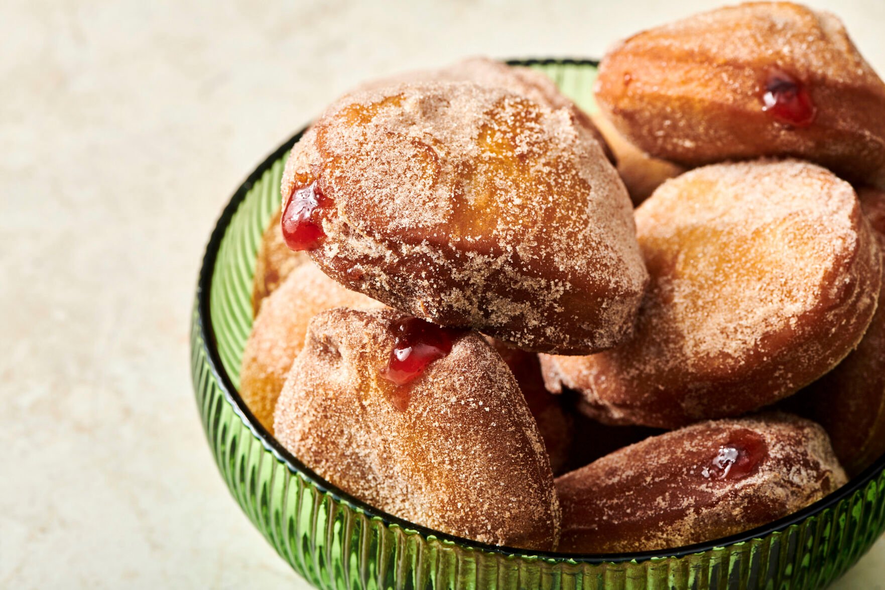 <p>A plate of jelly doughnuts are displayed in New York on Nov. 15, 2021. In Jewish homes, jelly doughnuts are often enjoyed during Hanukkah and are known as Sufganiyot. (Cheyenne Cohen via AP)</p>