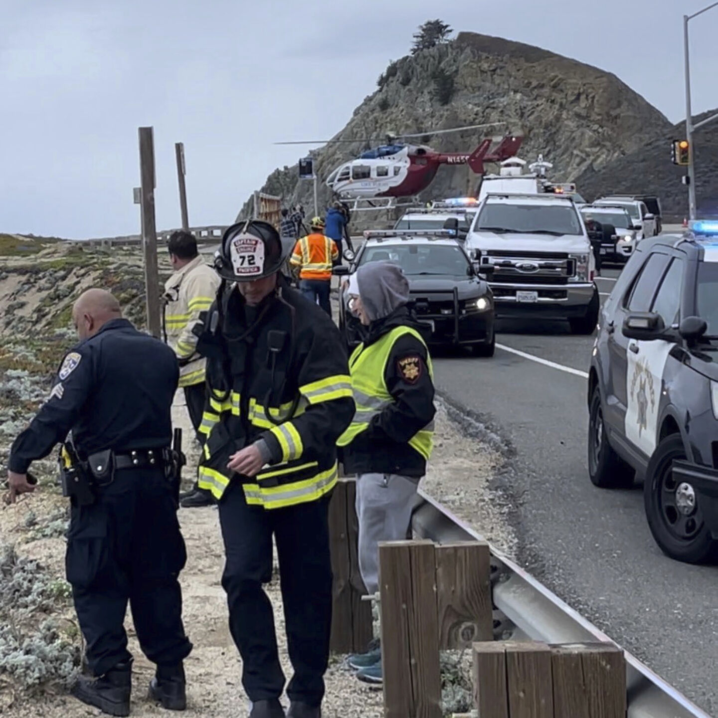 <p>In this image from video provided by San Mateo County Sheriff's Office, emergency personnel respond after a Tesla plunged off a Northern California cliff along the Pacific Coast Highway, Monday, Jan. 2, 2023, near an area known as Devil's Slide, leaving four people in critical condition, a fire official said.</p>
