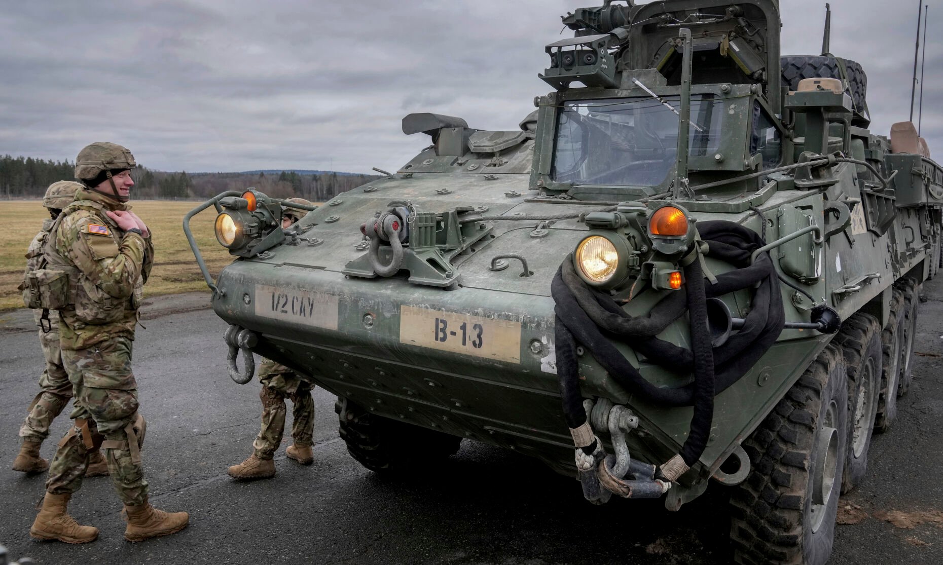 <p>Soldiers of the 2nd Cavalry Regiment stand next to a Stryker combat vehicle Feb. 9, 2022, in Vilseck, Germany.</p>