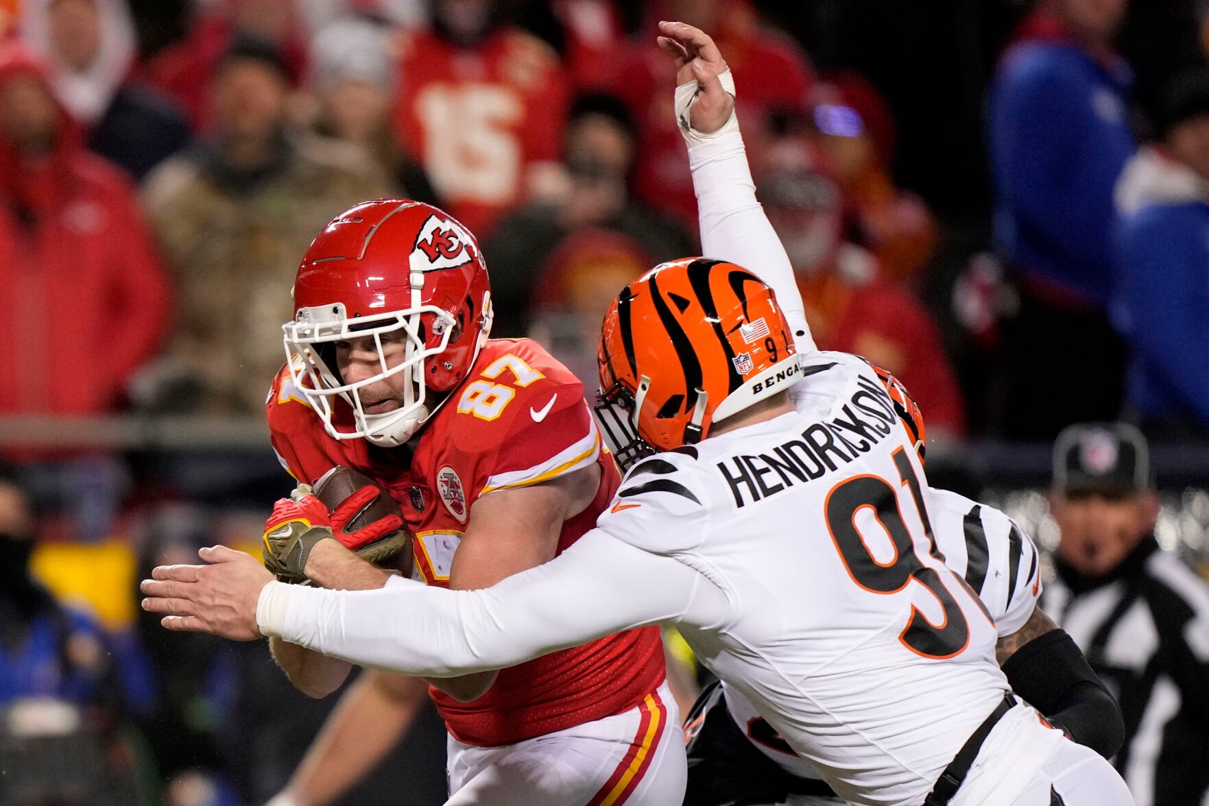 <p>Cincinnati Bengals defensive end Trey Hendrickson, left, hits Kansas City Chiefs tight end Travis Kelce during the first half of Sunday's AFC championship game in Kansas City, Mo.</p>