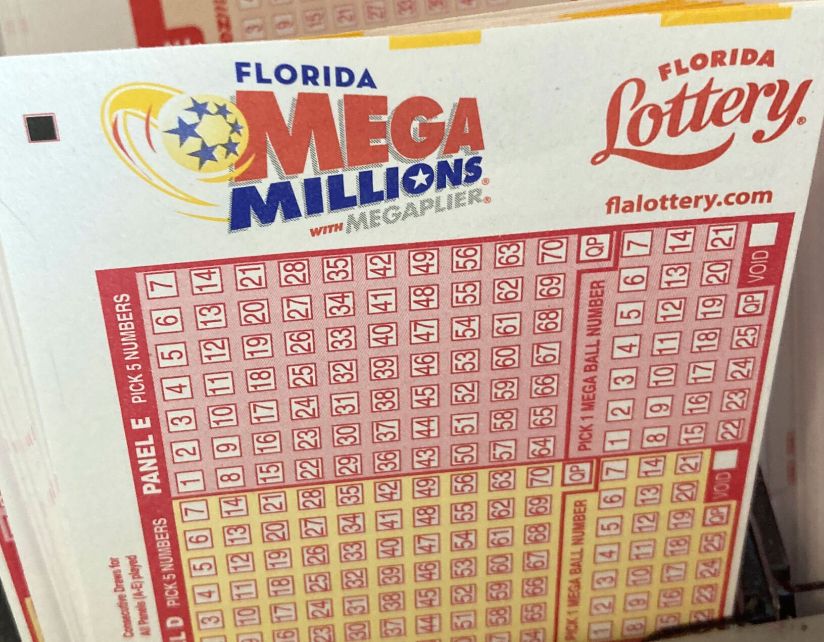 <p>Mega Millions lottery playing slips are shown at a supermarket kiosk Monday in Surfside, Fla.</p>